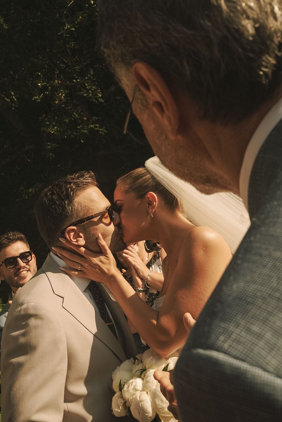 Candid wedding photography showing joyful laughter between newlyweds.