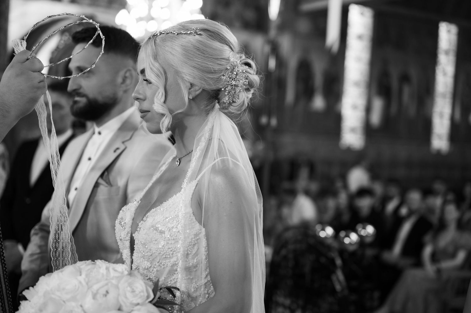 Intimate wedding ceremony moment captured in black and white photography.