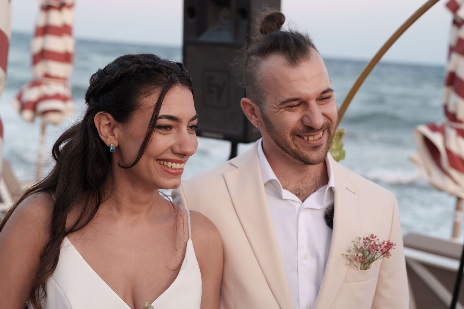 Romantic beach wedding couple shares intimate moments together in a photo collage by the ocean.