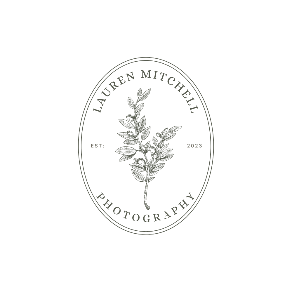 A black and white circular logo design featuring a botanical leaf branch motif and text for a photographer brand identity.