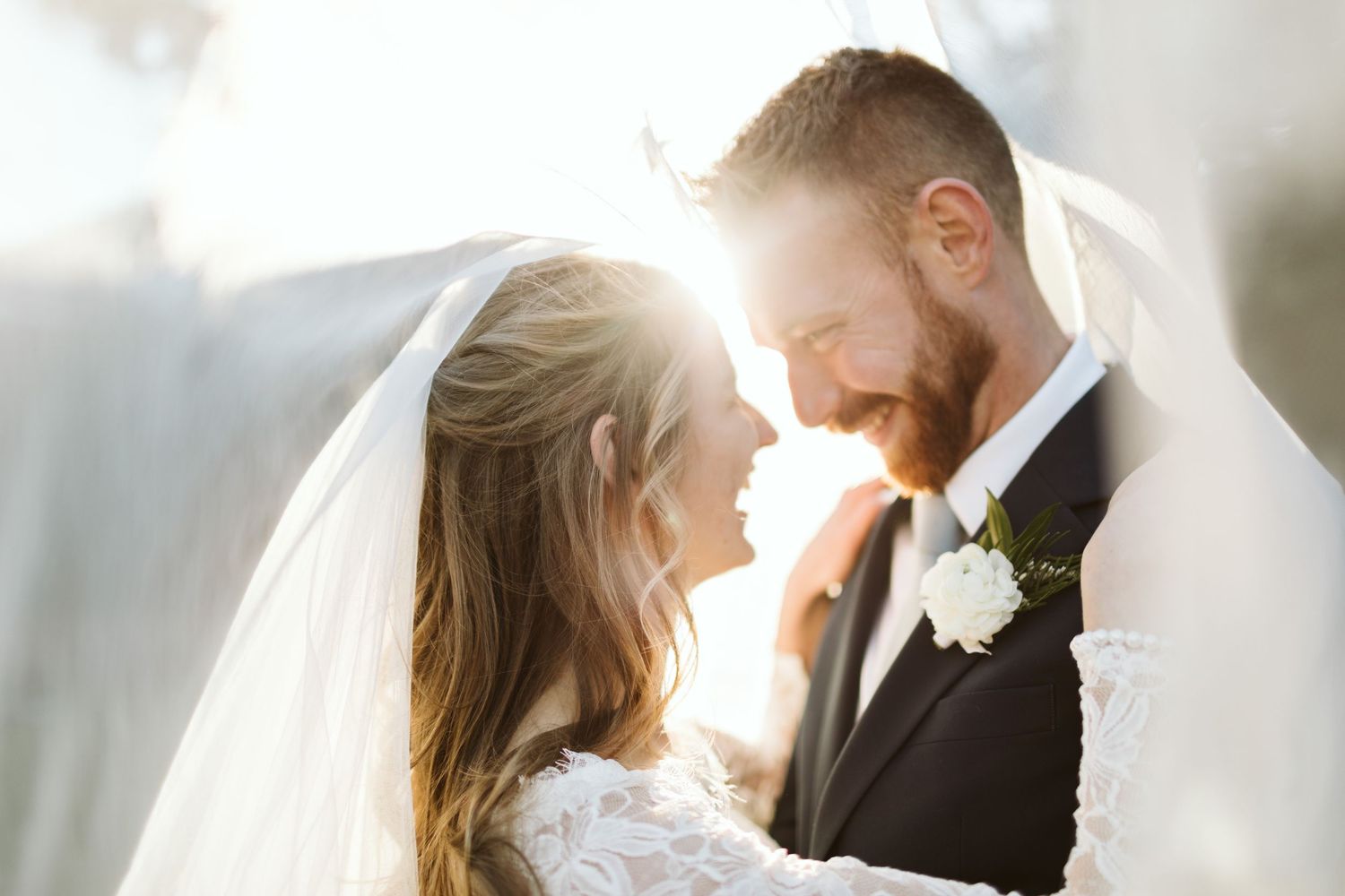 Romantic wedding couple shares intimate moments in a series of soft, light-filled portraits.