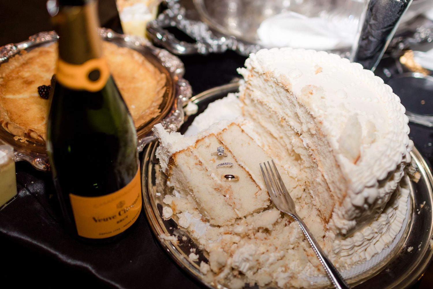 A series of images showing champagne bottles and glasses with wedding cake and wedding rings.