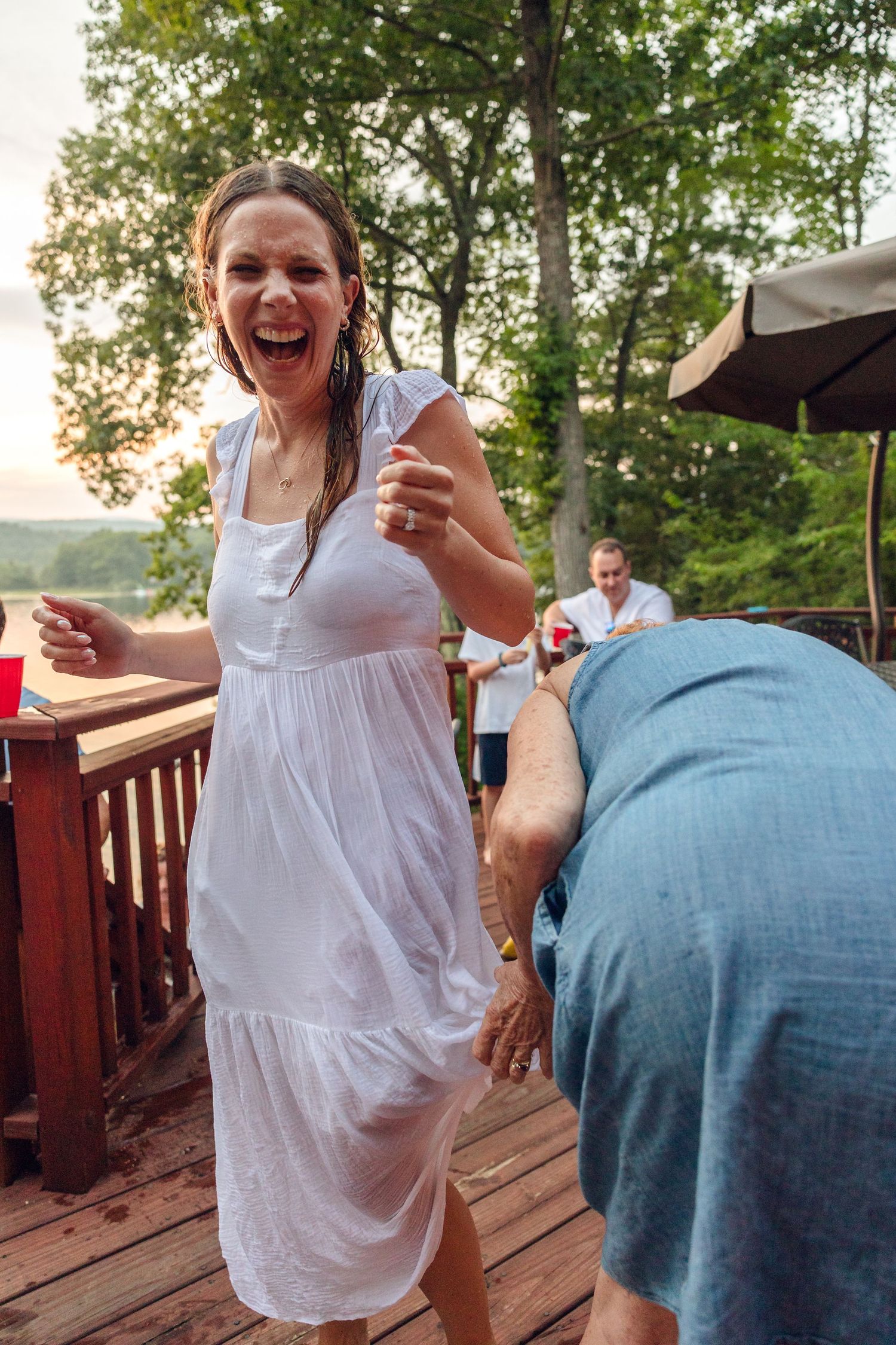 A series of candid moments showing joyful laughter and interaction on an outdoor wooden deck.