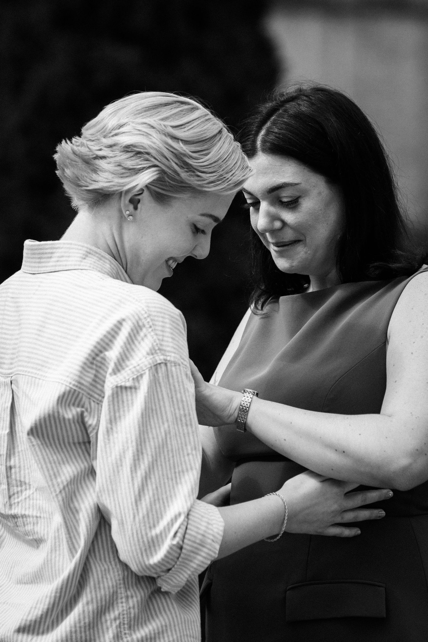 Black and white intimate moment captured during an engagement photoshoot.