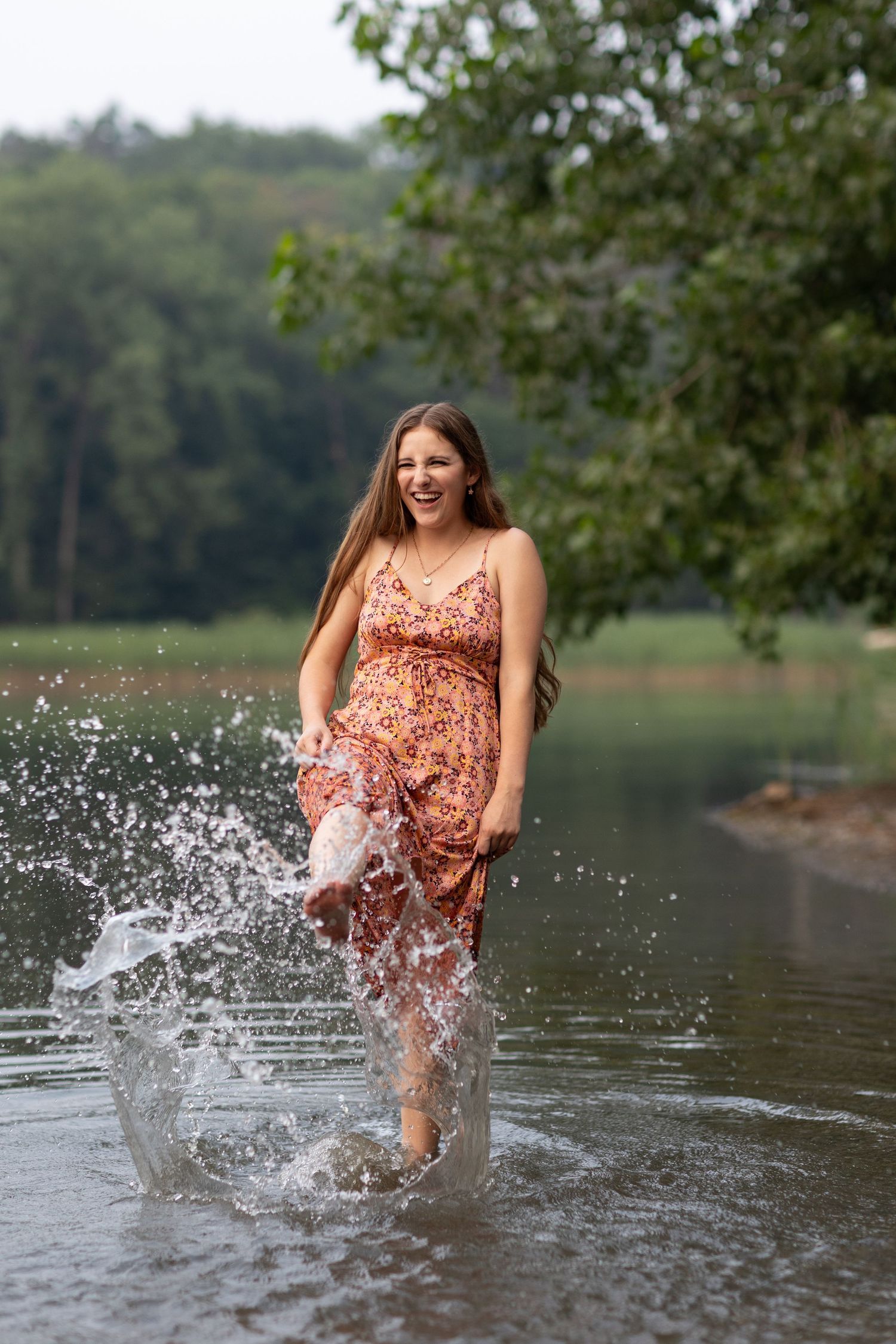 Splashing water creates dynamic movement during a lakeside photoshoot.