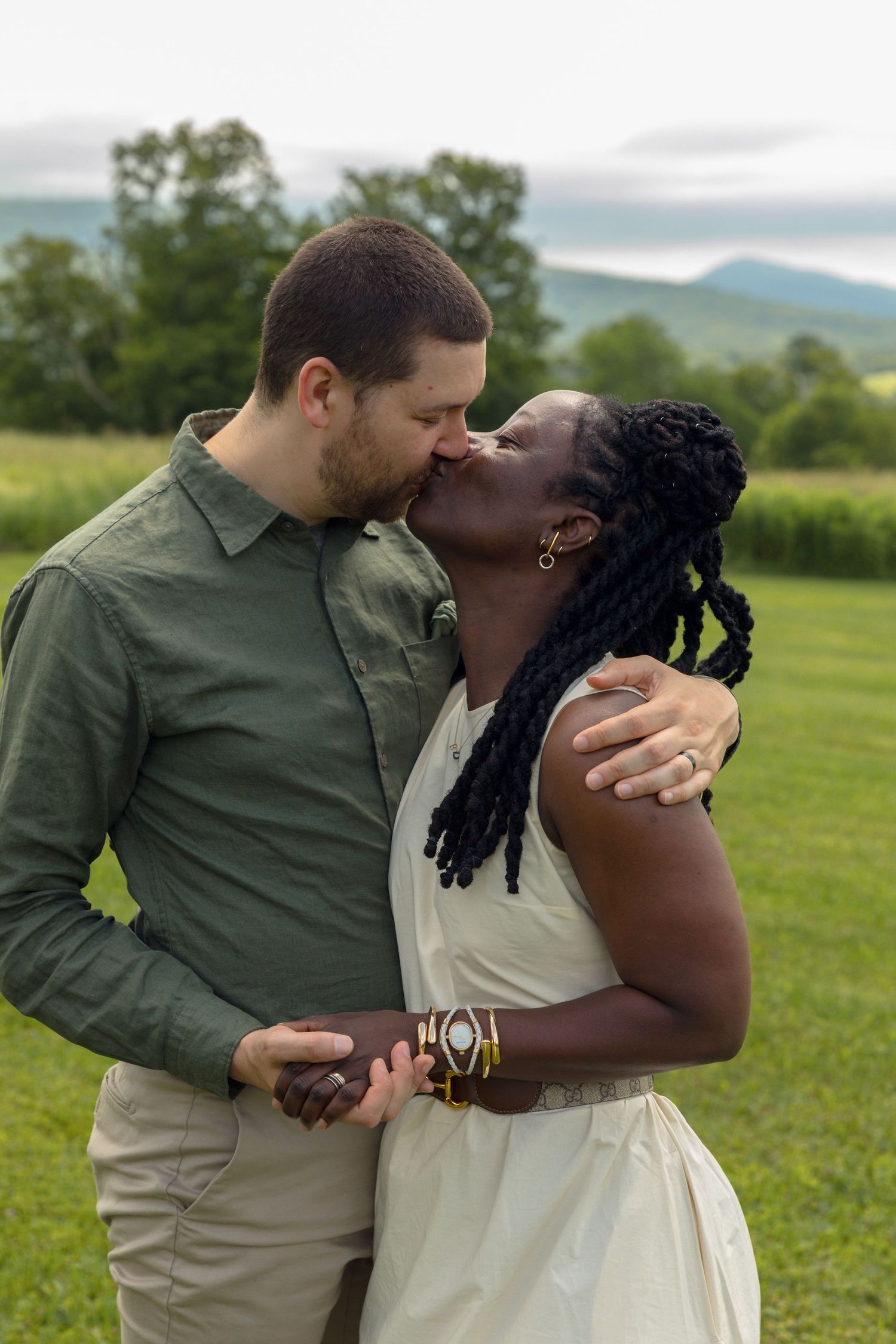 Romantic couple sharing an intimate moment in a beautiful outdoor setting.