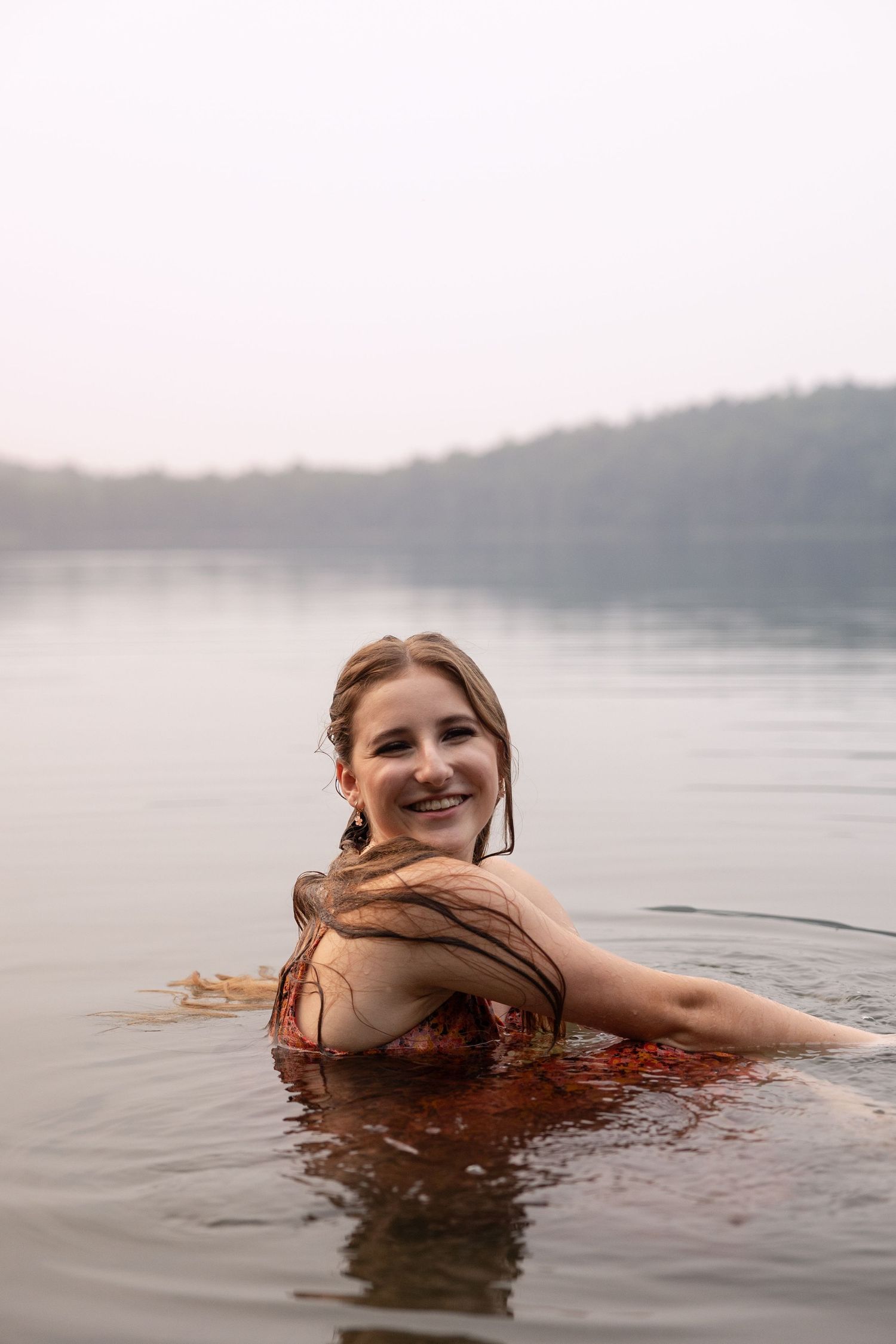 A peaceful floating pose captured in serene lake waters.