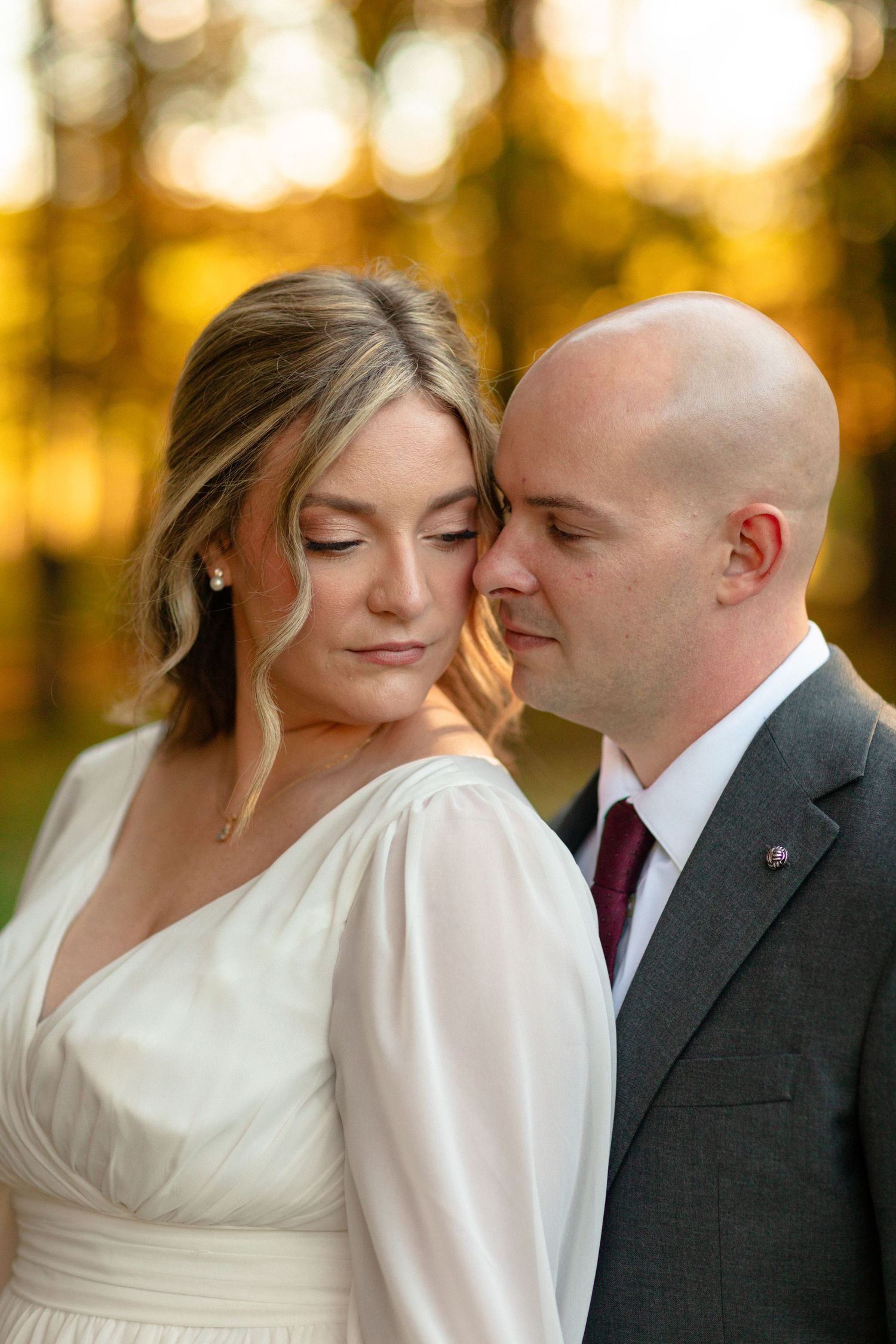 Intimate wedding portraits showing tender moments between a couple.