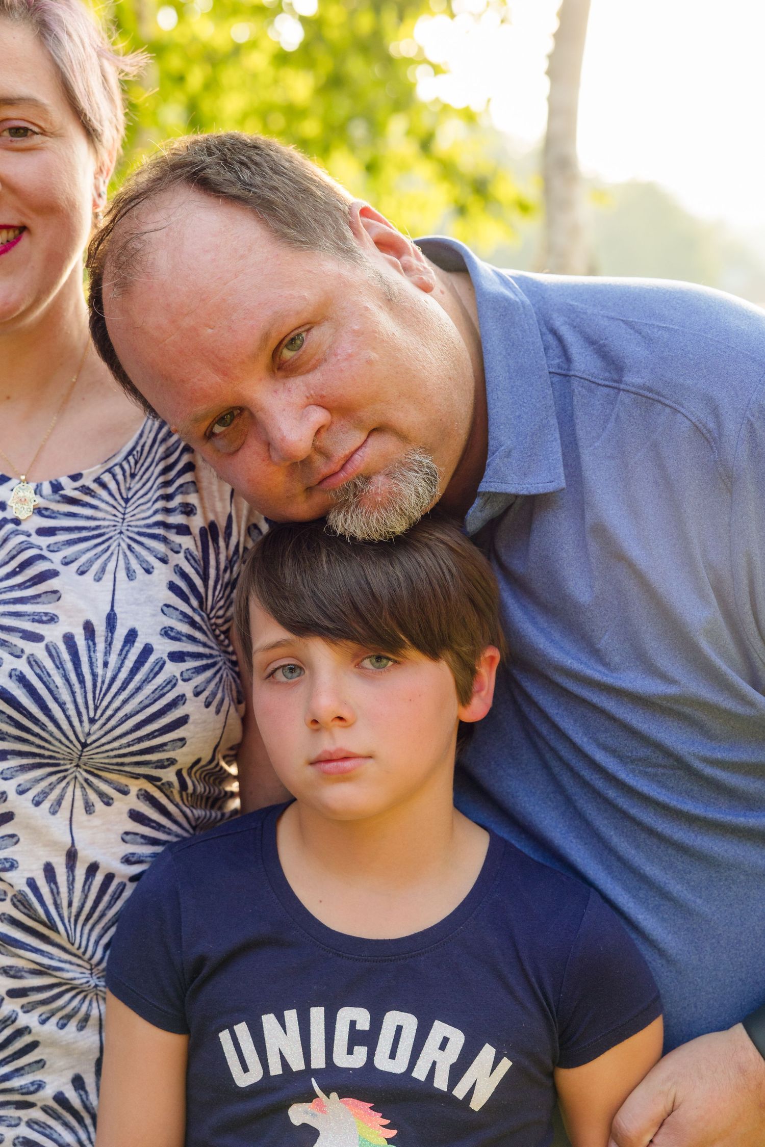 Close-up portrait series showing affectionate family moments in casual summer attire.