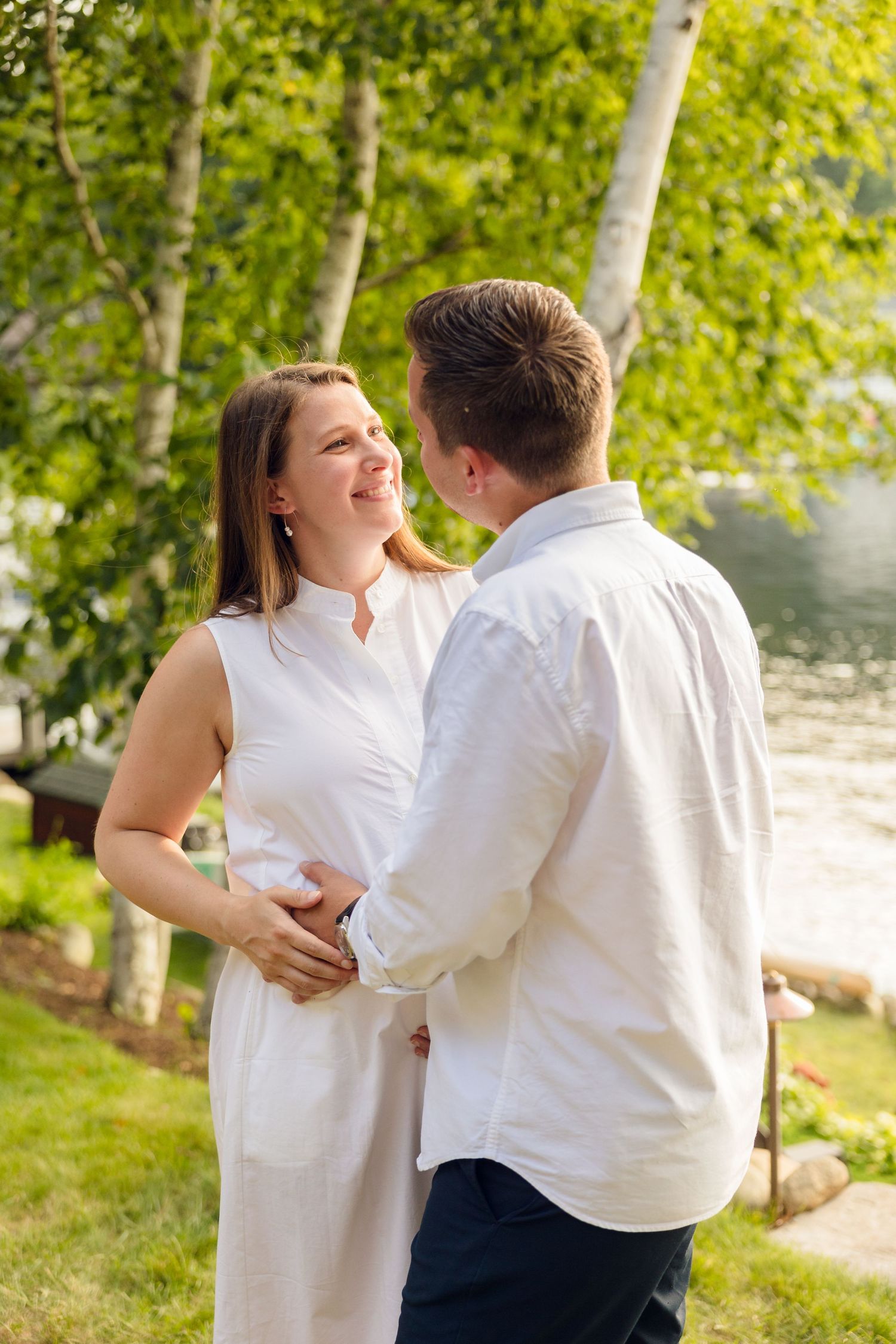 Candid moments of laughter and joy captured during an outdoor photoshoot near birch trees.