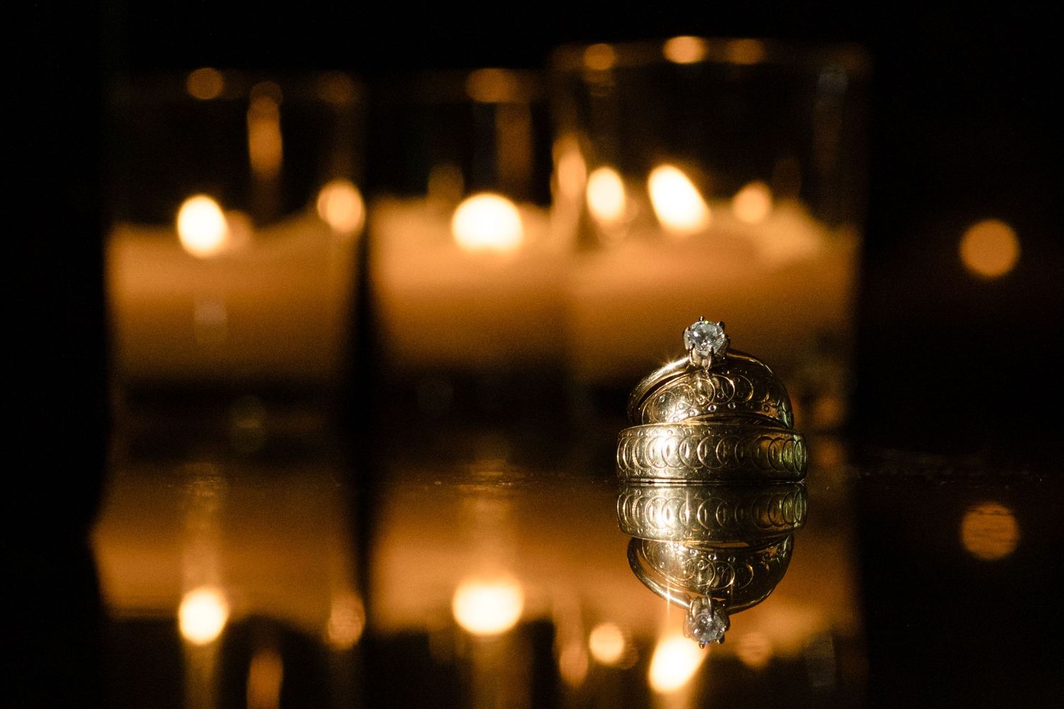 Glowing glass ornaments and candlelight creating romantic ambiance at an evening event.