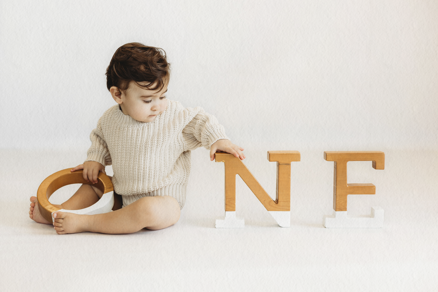 Baby with ONE letter blocks celebrating their first birthday in Dbayeh, Lebanon