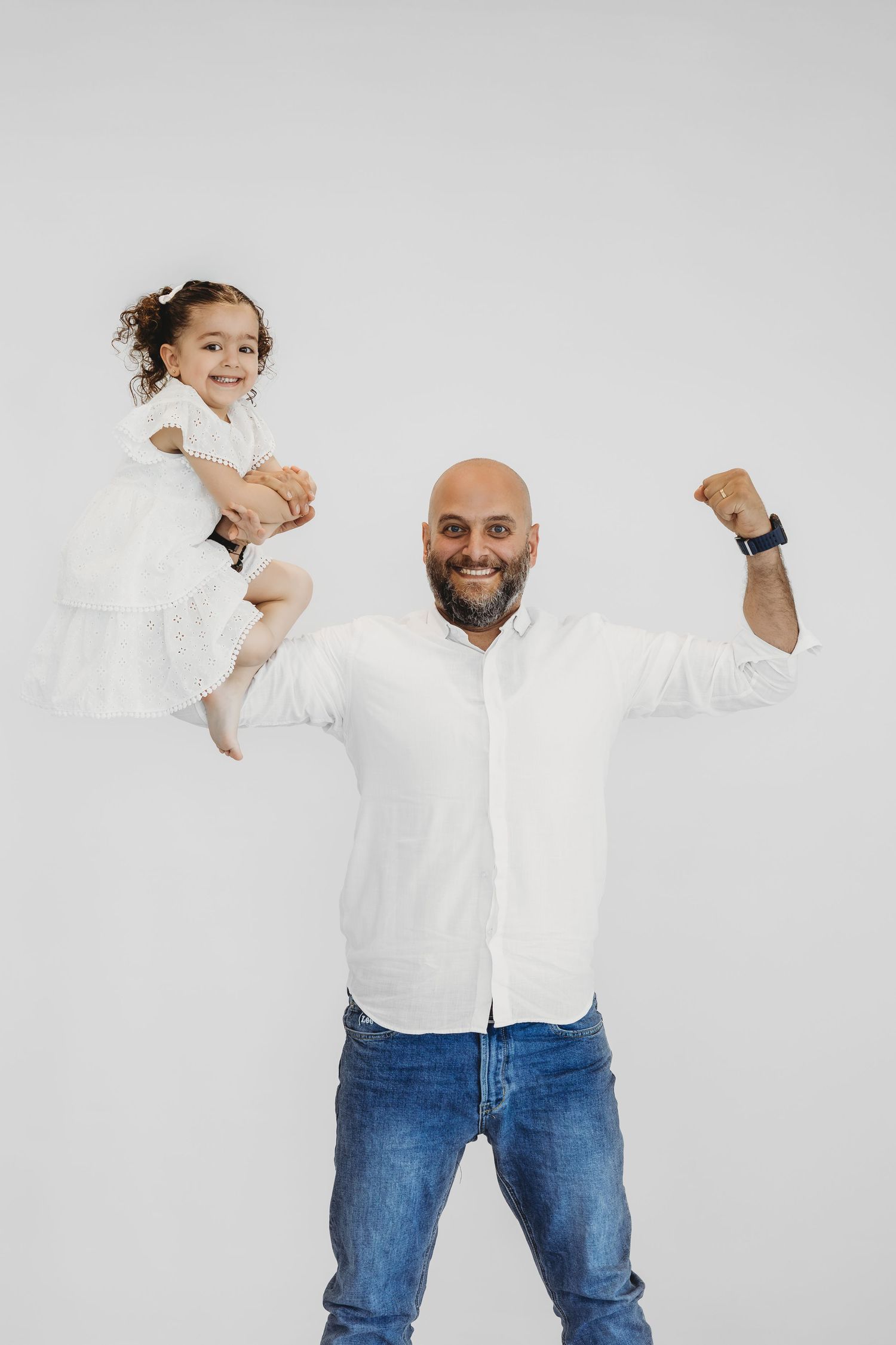Loving family moment captured in a calm white studio in Lebanon