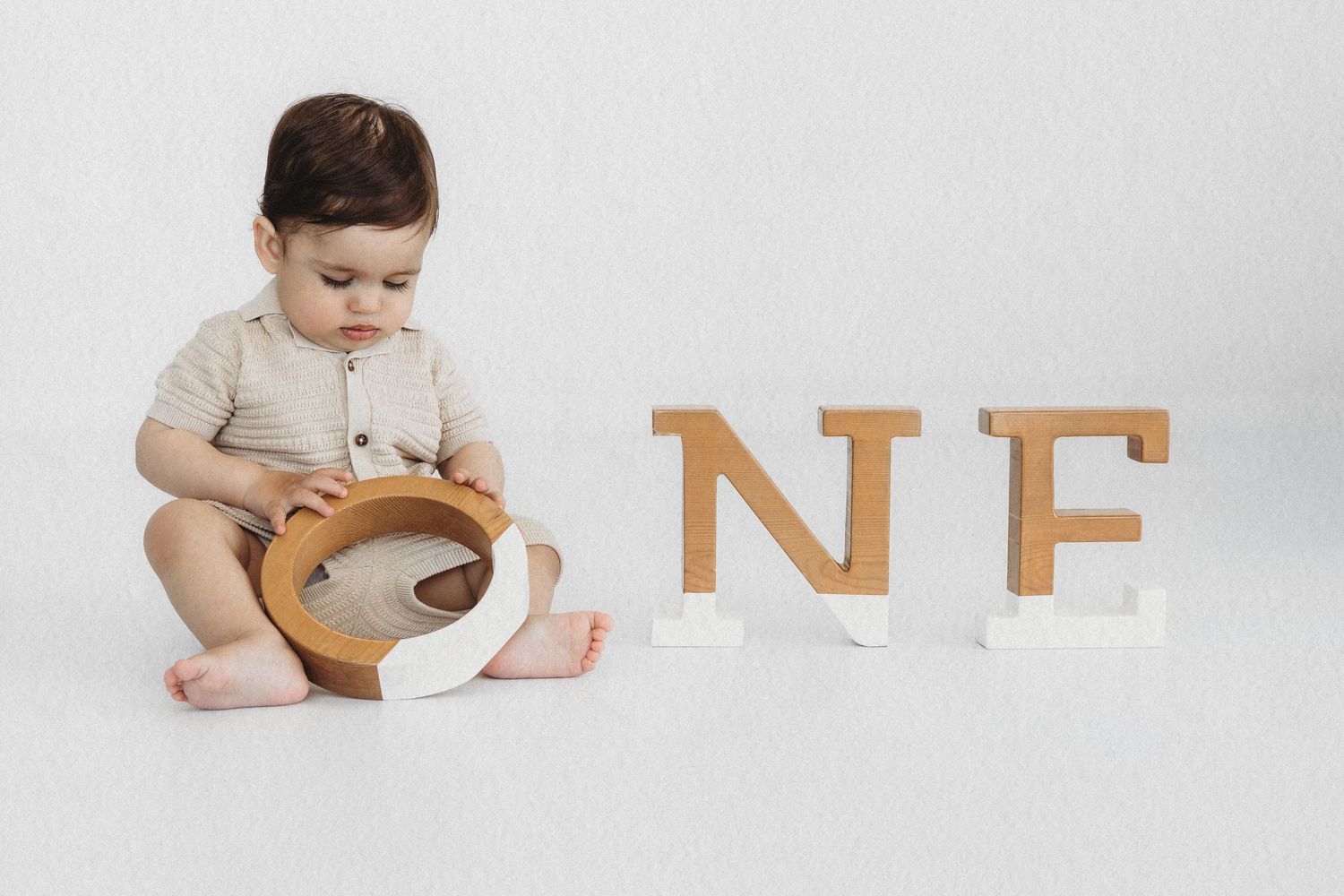 Baby with ONE letters celebrating their first birthday cake smash in Dbayeh, Lebanon