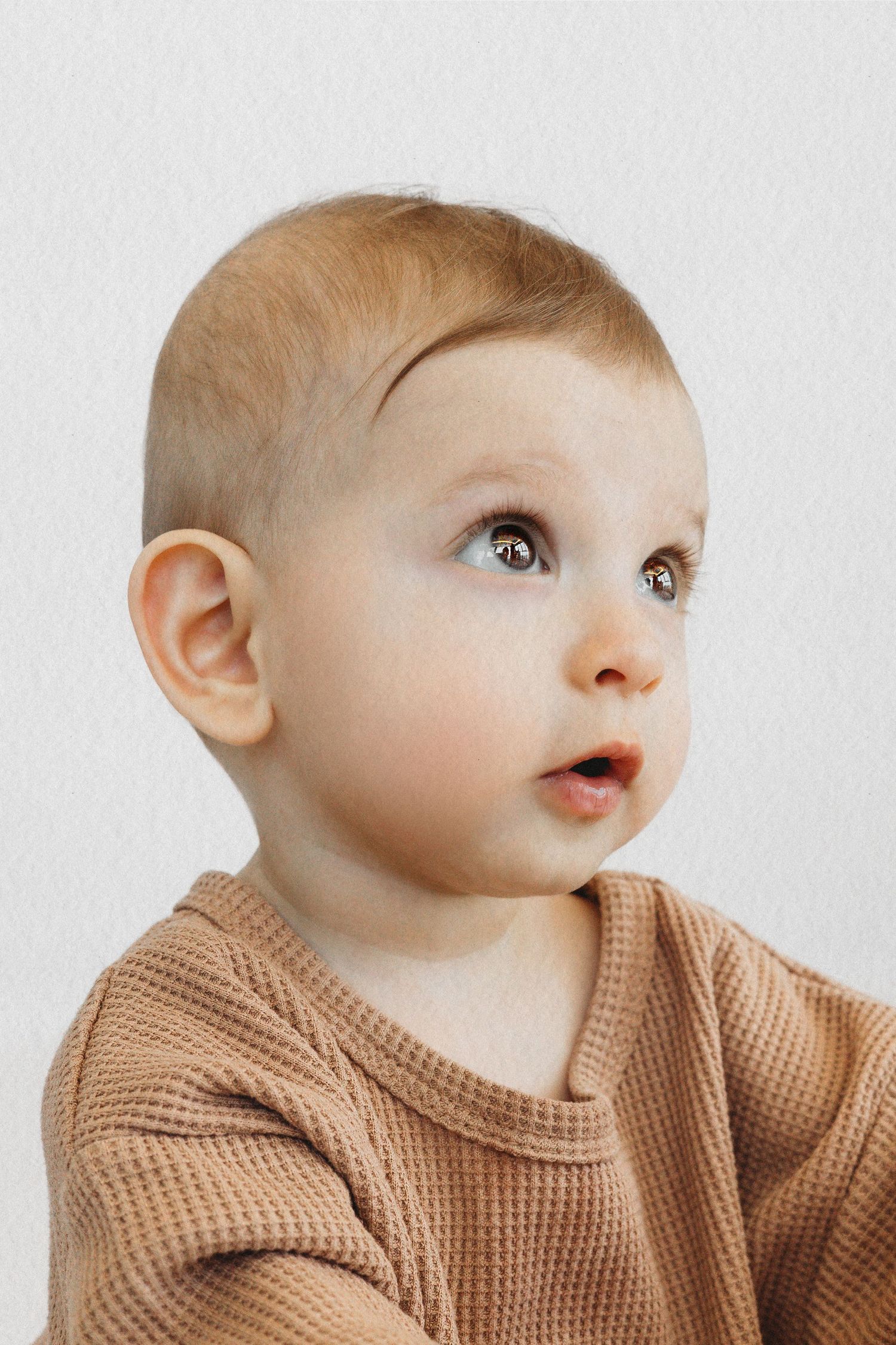 Baby boy during a natural studio milestone session in Dbayeh, Lebanon