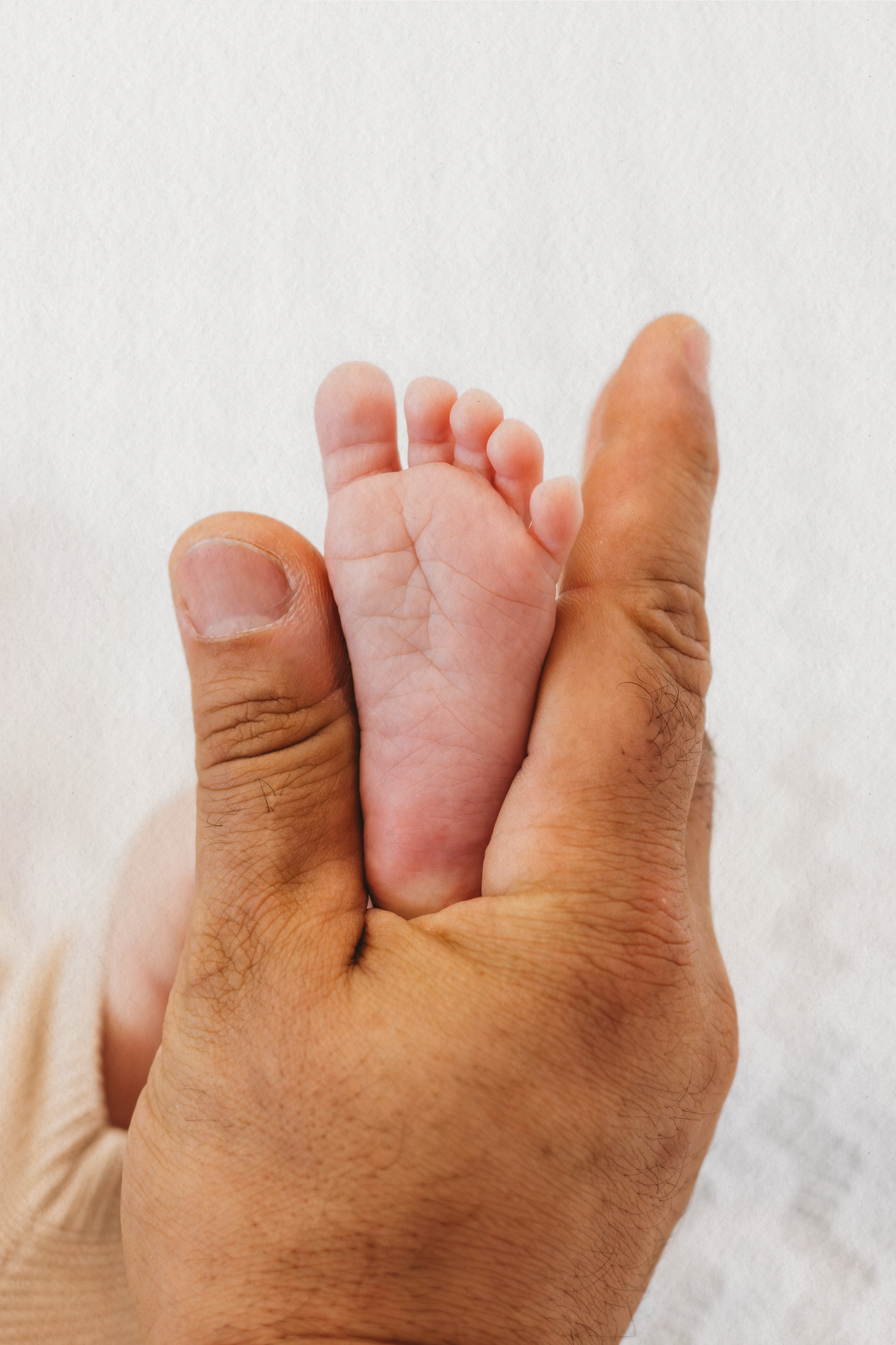 Close-up of tiny newborn feet during a newborn photoshoot in Dbayeh, Lebanon