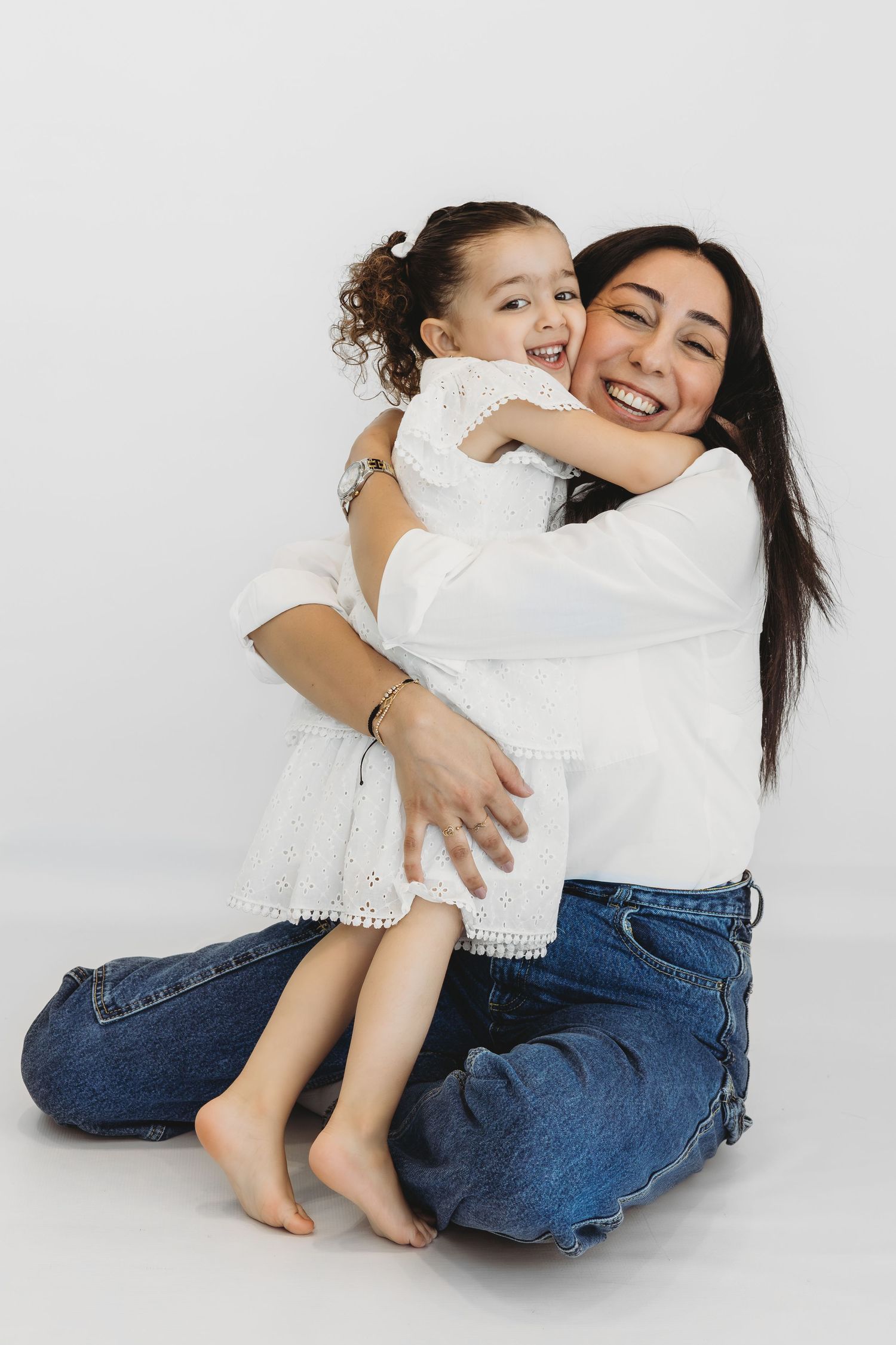 Mother embracing her child during a heartfelt family session in Dbayeh, Lebanon