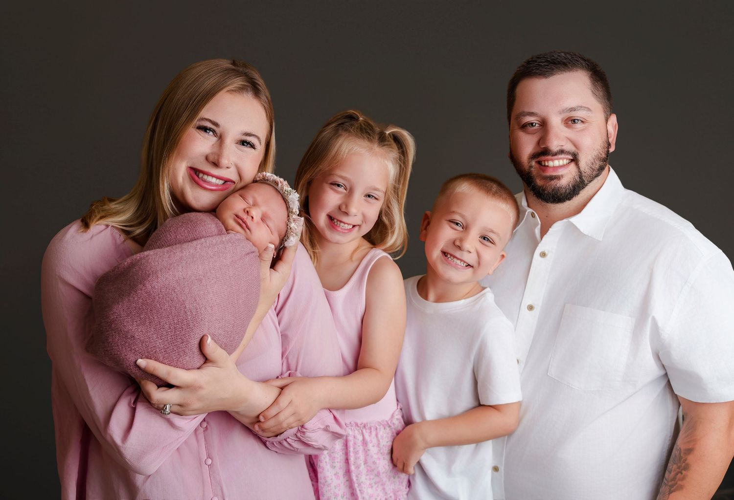 Studio Family Portrait of Mom, Dad, 2 young children and newborn during a Newborn Session for clients from Columbia, South Carolina.