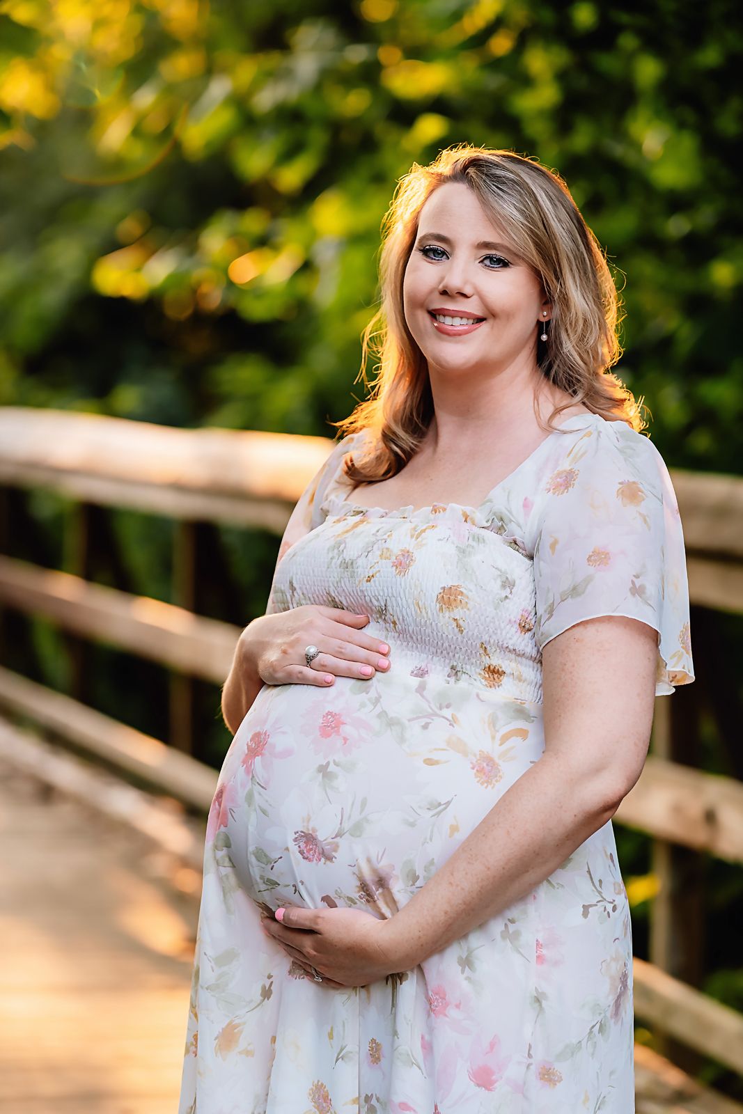 Beautiful mom to be during a gorgeous evening Maternity Session in Chapin SC with the light creating a stunning glow behind her.