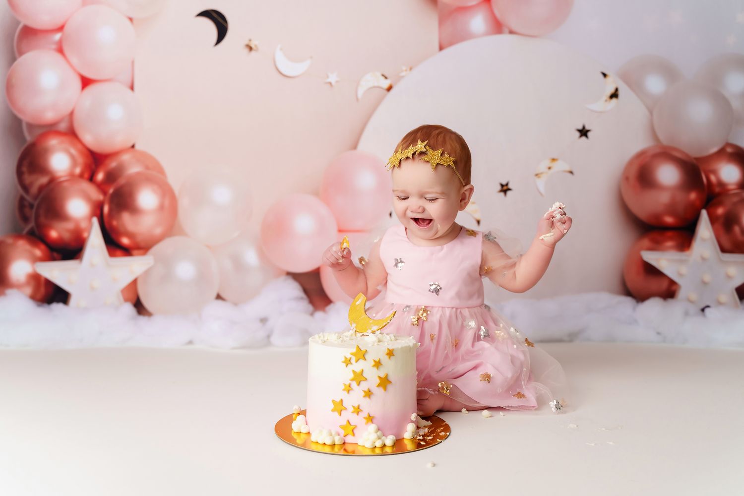 Pink, rose gold and cream colors for a girly celestial themed studio cake smash session for clients from Lexington SC.