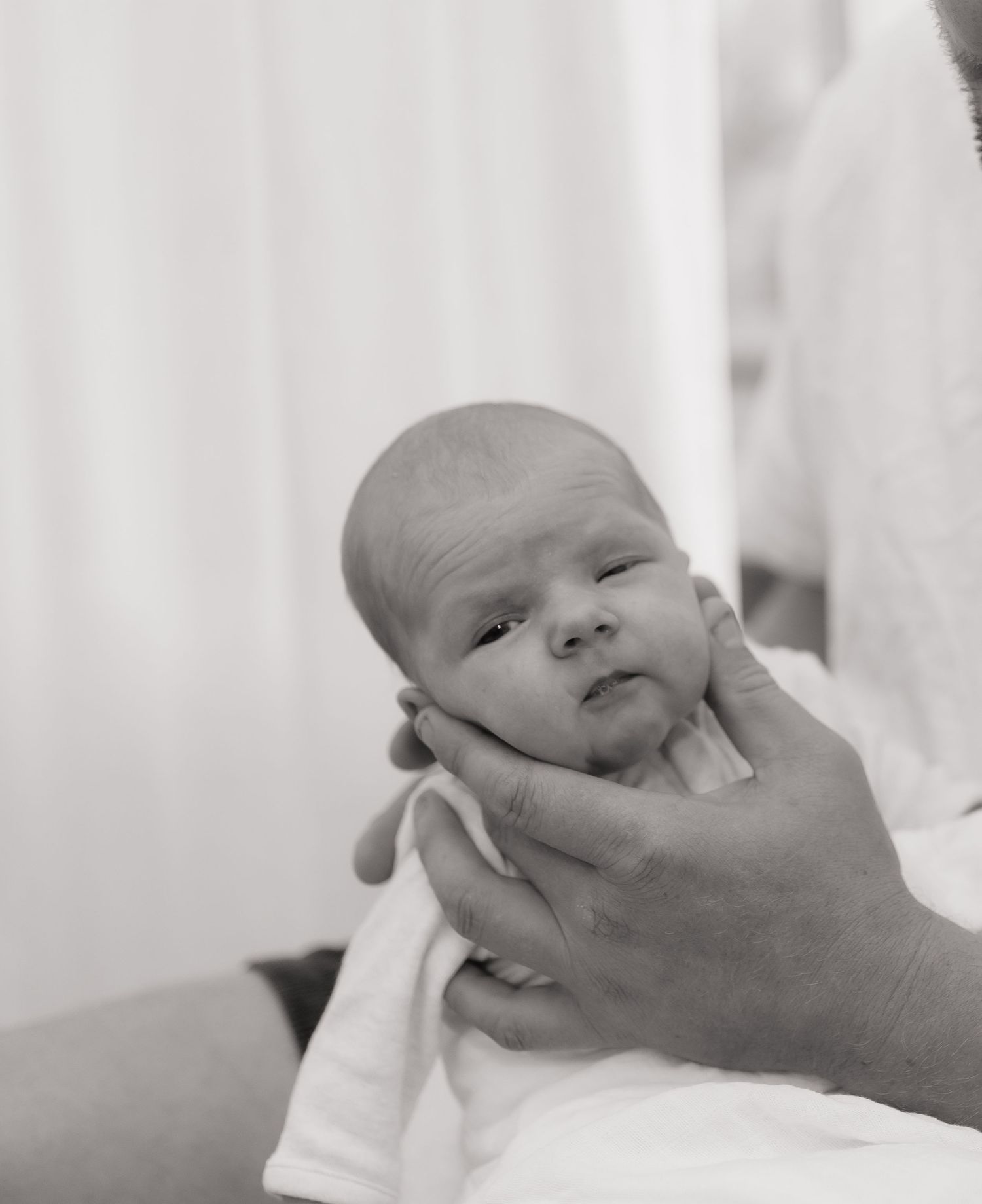 Brisbane newborn photographer — close-up black and white portrait of sleeping newborn baby, delicate and serene in-home session by Joy Fille