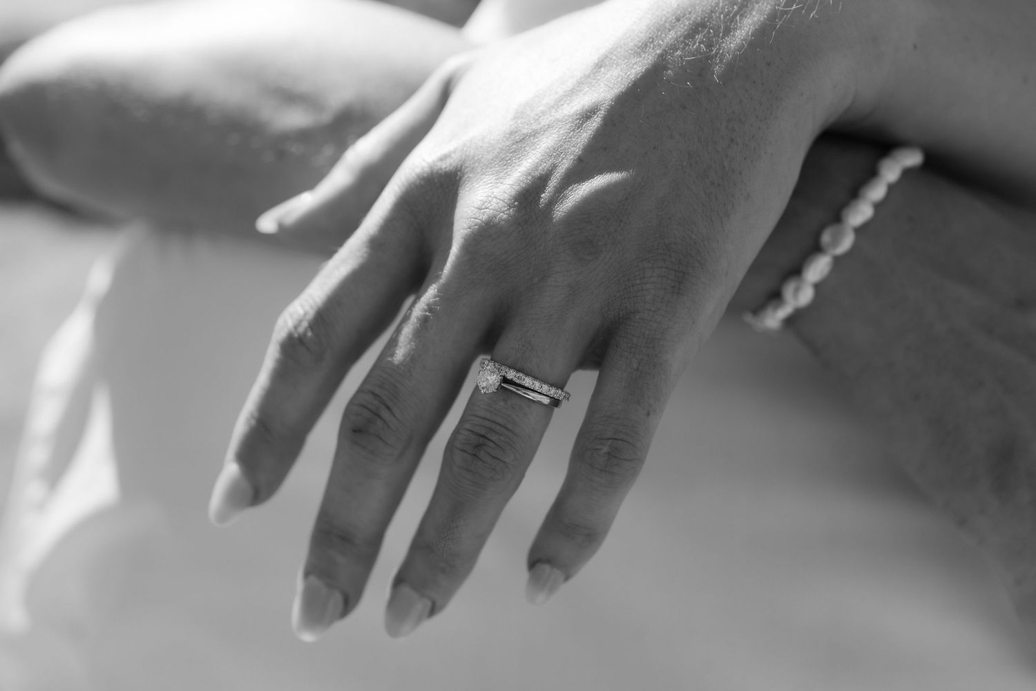 Brisbane wedding photographer — close-up of bride's hand with elegant engagement ring, beautiful wedding detail shot by Joy Filled Photograp
