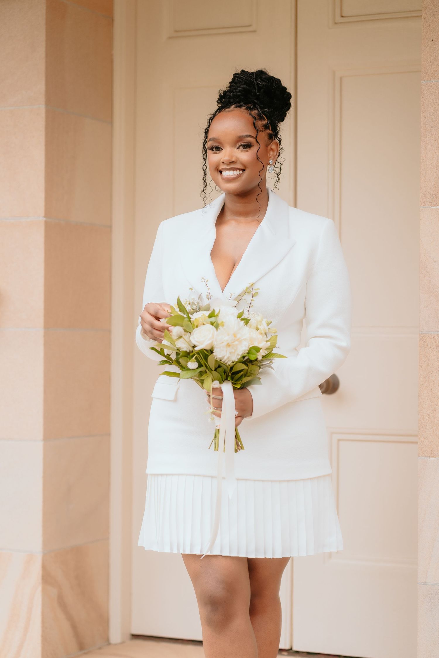 Brisbane elopement photographer — beautiful bride in white mini dress holding a bouquet, radiant and confident bridal portrait by Joy Filled