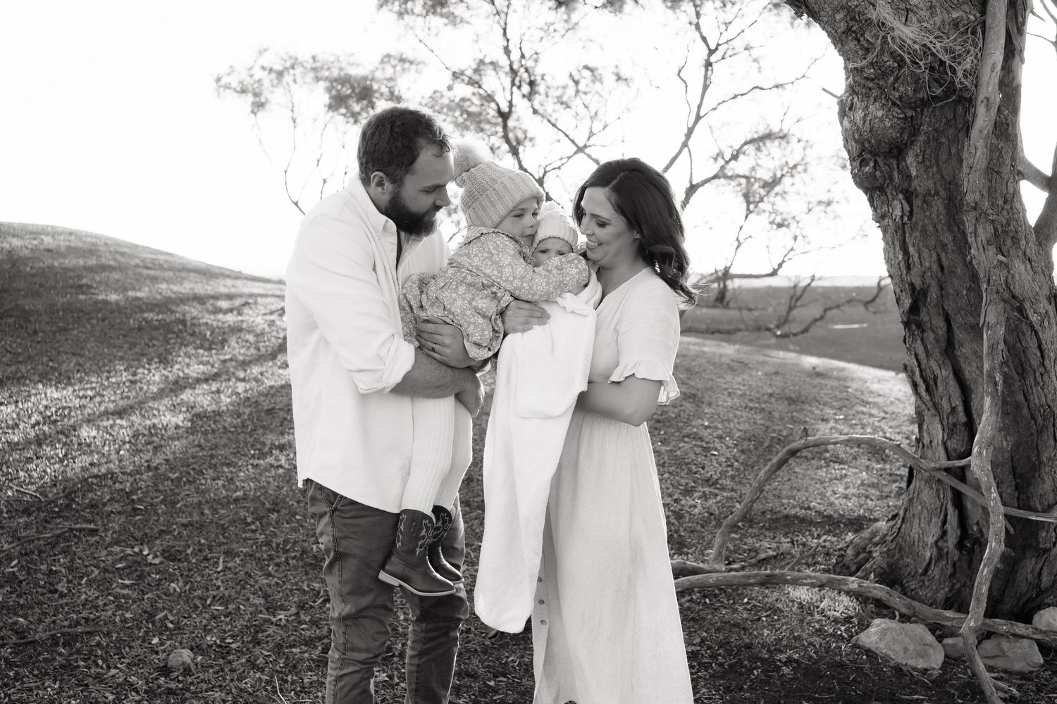 Brisbane maternity photographer — black and white couple portrait outdoors near a tree, intimate and emotive maternity session by Joy Filled