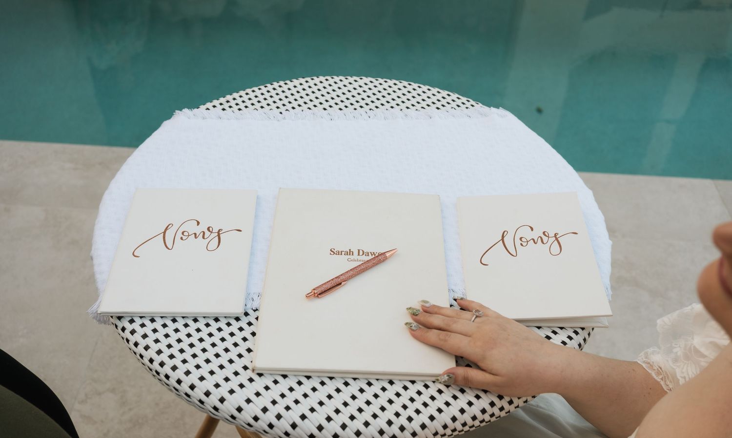 Brisbane wedding photographer — wedding stationery and invitations by the pool at outdoor wedding venue, detail shot by Joy Filled Photograp