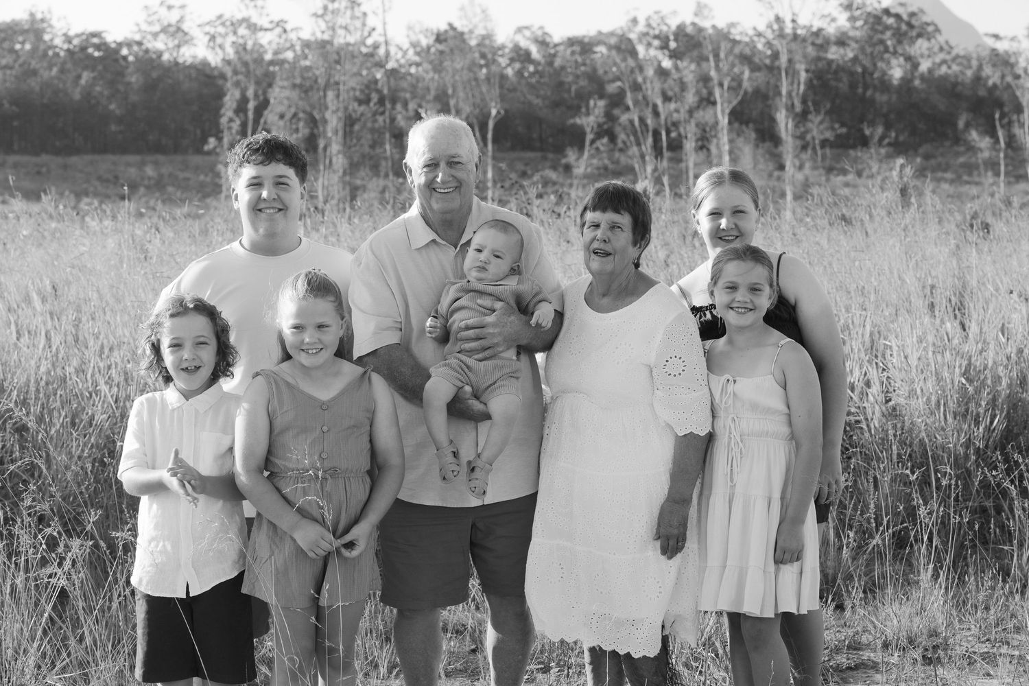 Brisbane family photographer — large extended family group in black and white, multigenerational outdoor family portrait session by Joy Fill