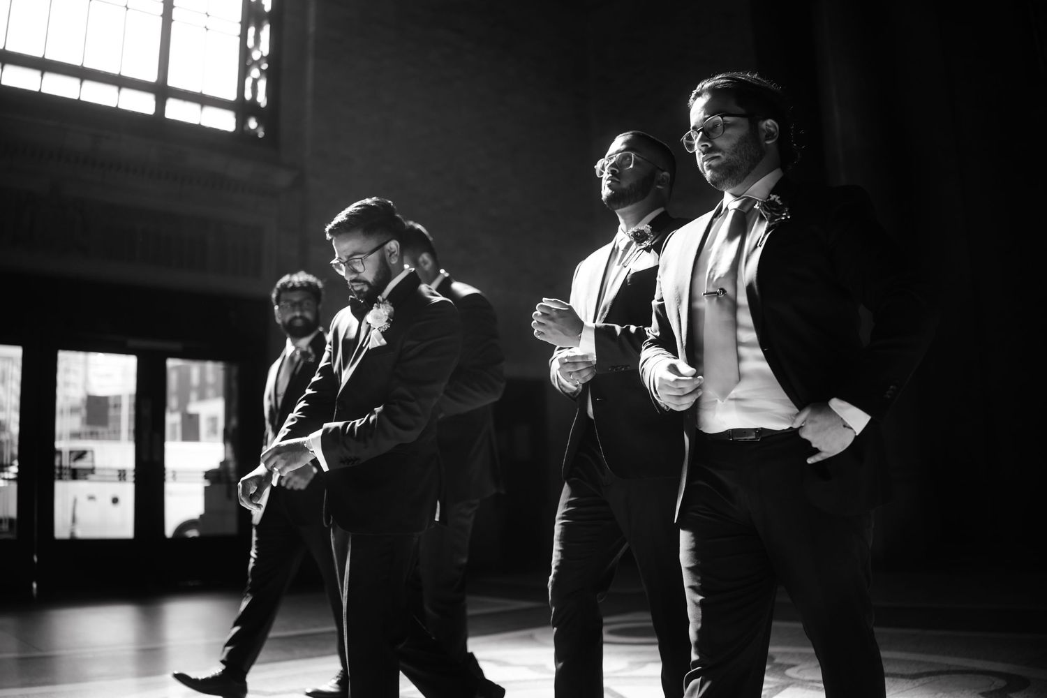 Black and white film stills showing performers in dramatic lighting on stage during a theatrical production.