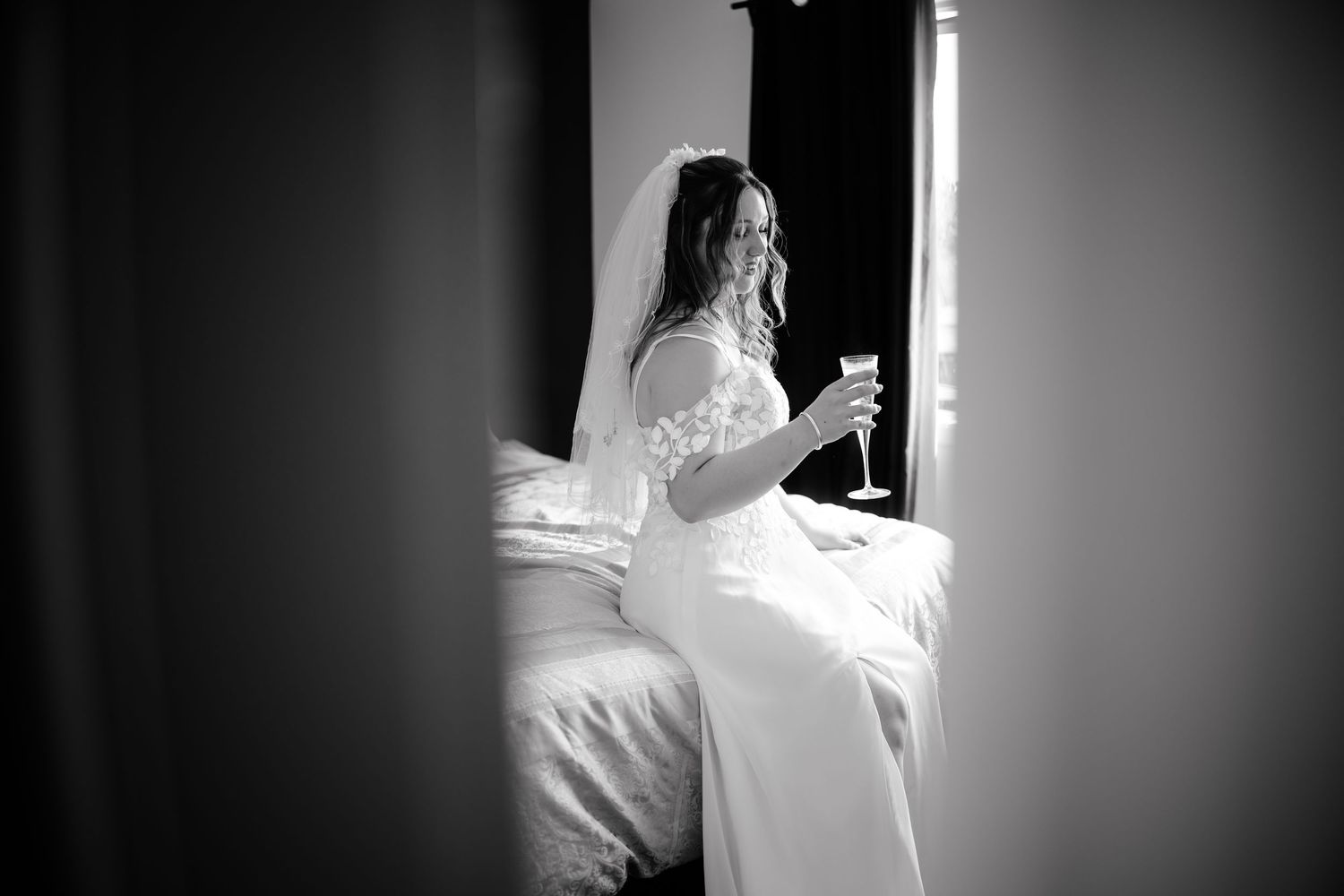 A series of black and white photos showing someone in a white shirt standing near a window in silhouette.