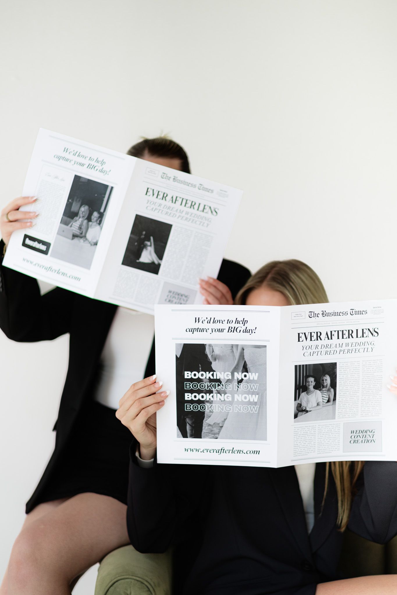 Two people holding Ever After Lens wedding photography newspaper advertisements while seated against a white background.