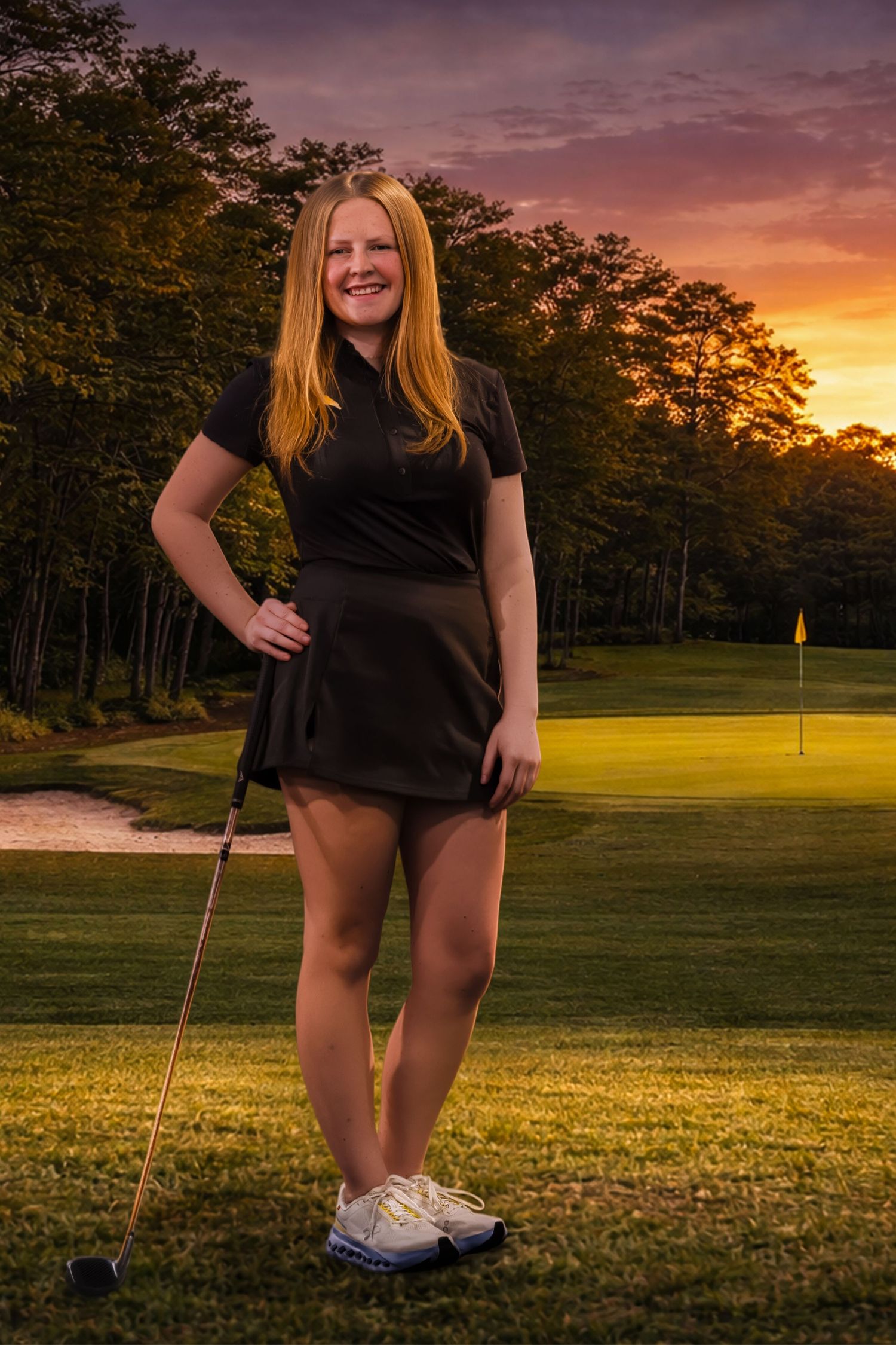 Golfer poses with club on scenic golf course during golden sunset with trees and flag in background.
