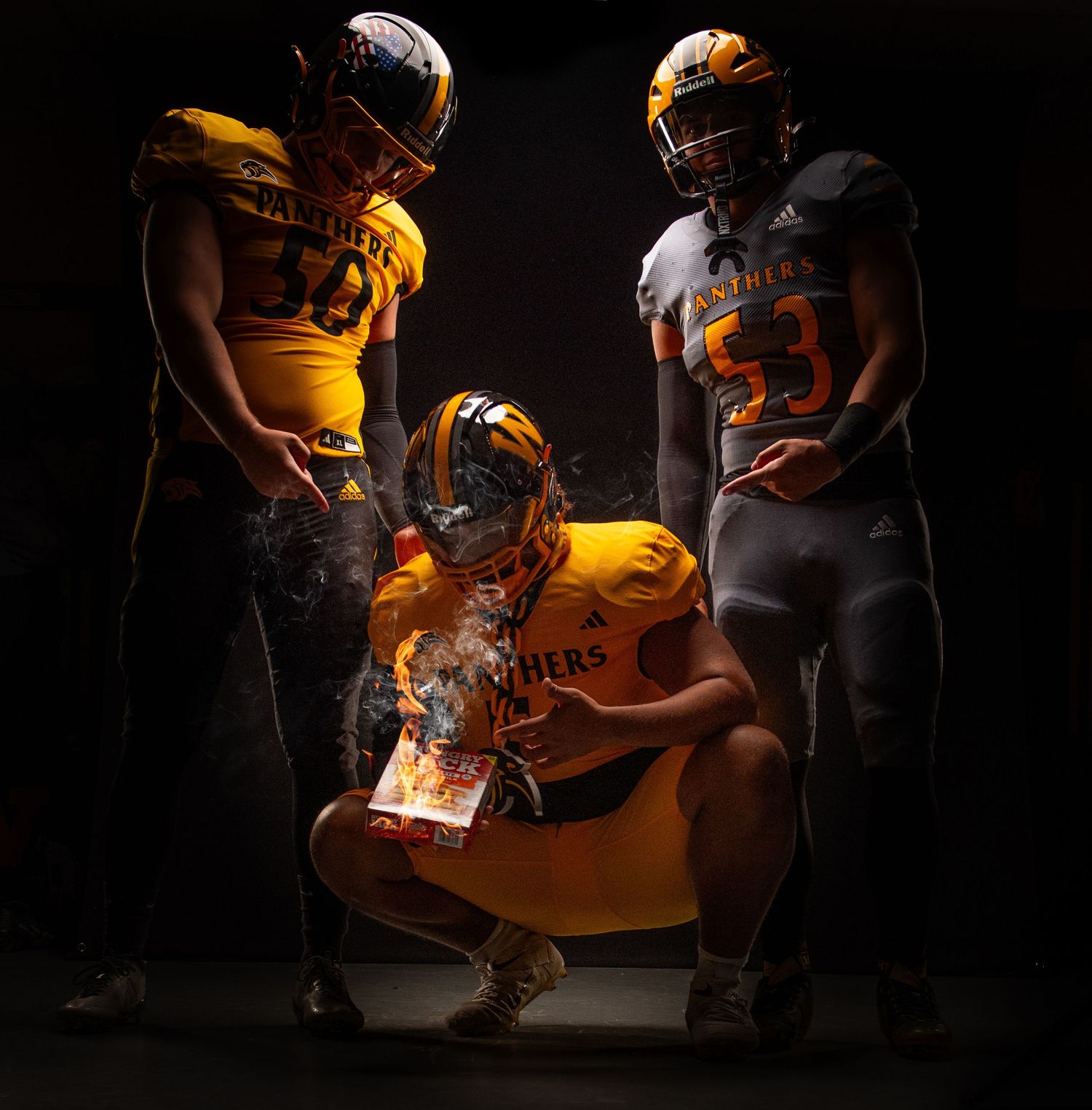 Dramatic moody sports photo series showing football players in yellow uniforms against dark backgrounds with lighting effects.