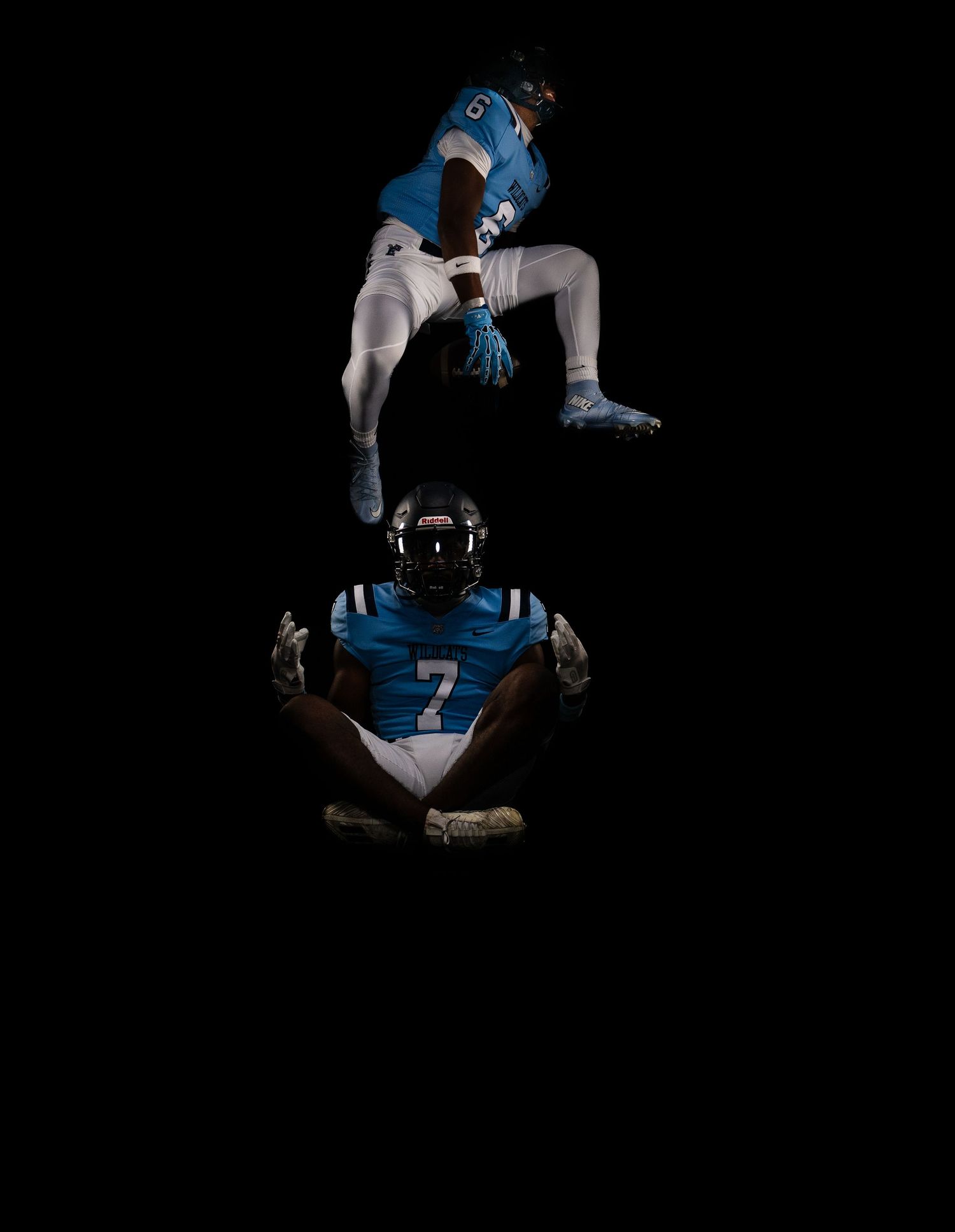 Football player in blue jersey number 7 poses in athletic stance.