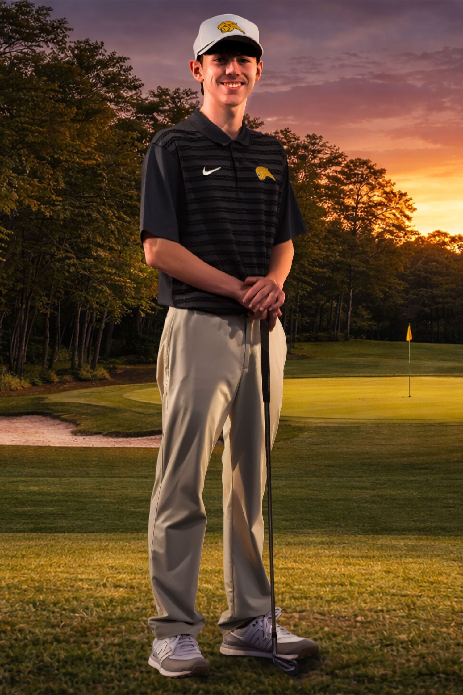 Golf team photo at sunset on golf course with sand trap and flag in background wearing Nike polo and white cap.