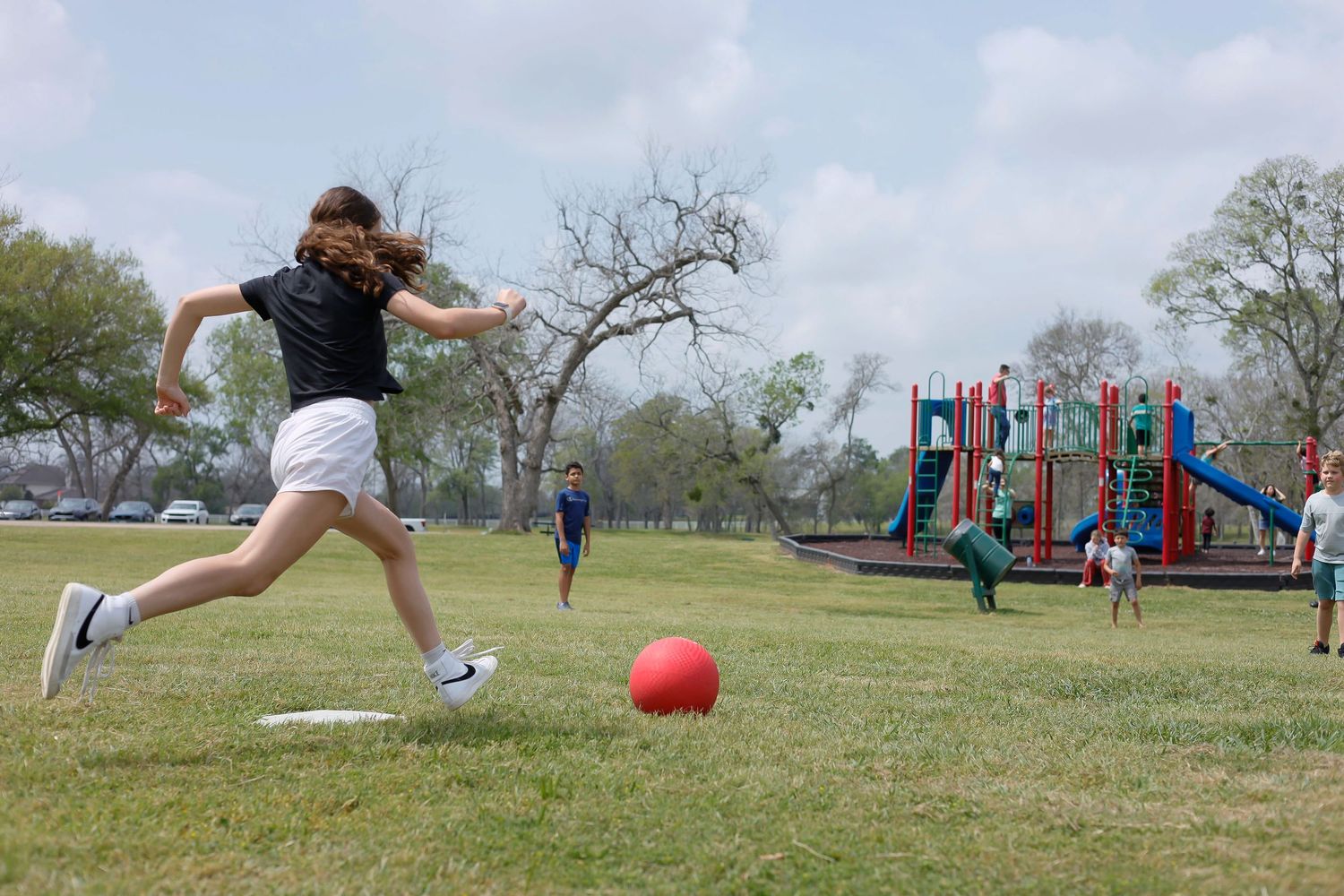 playing soccer at a park