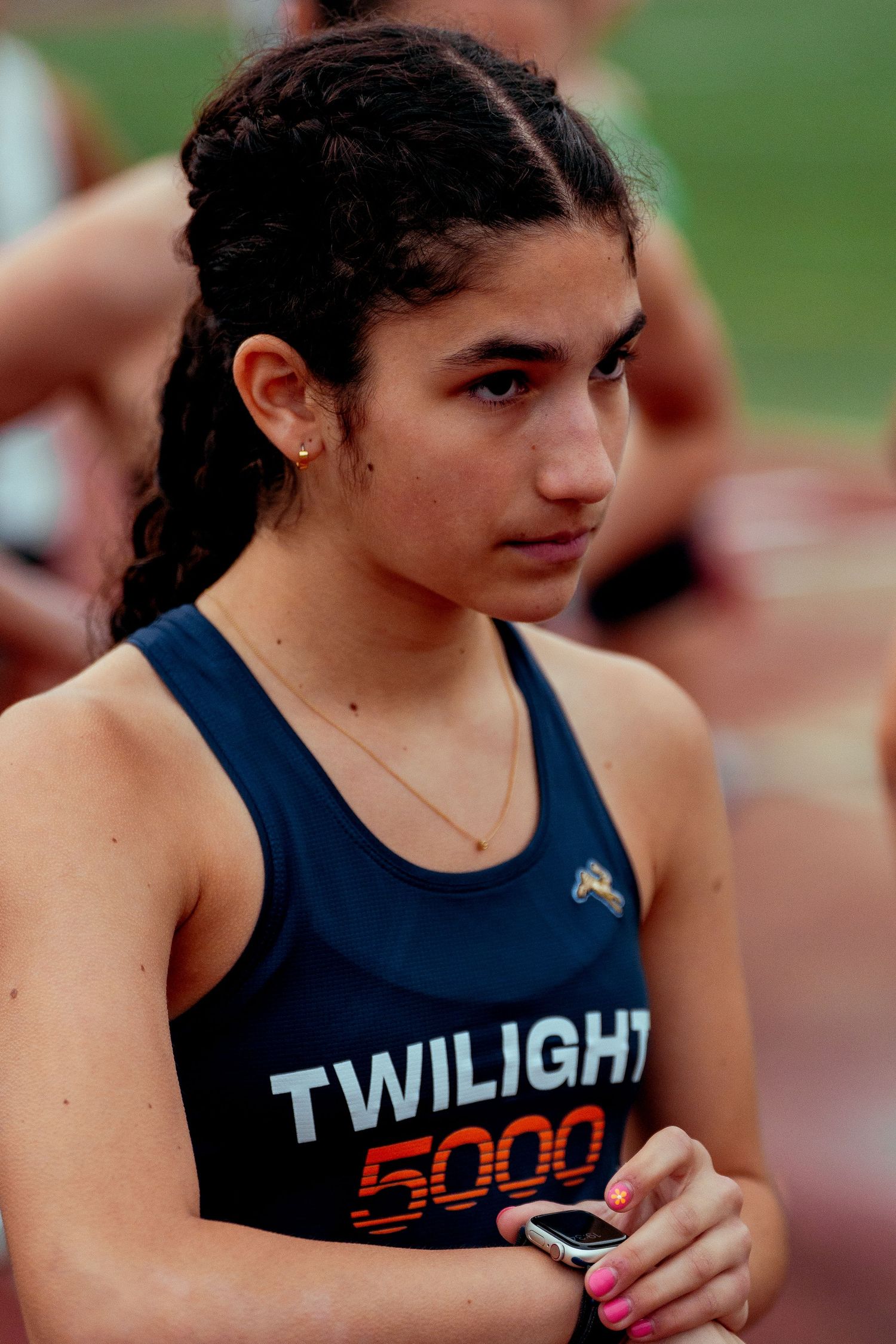 Close up of navy blue athletic jersey with orange text.