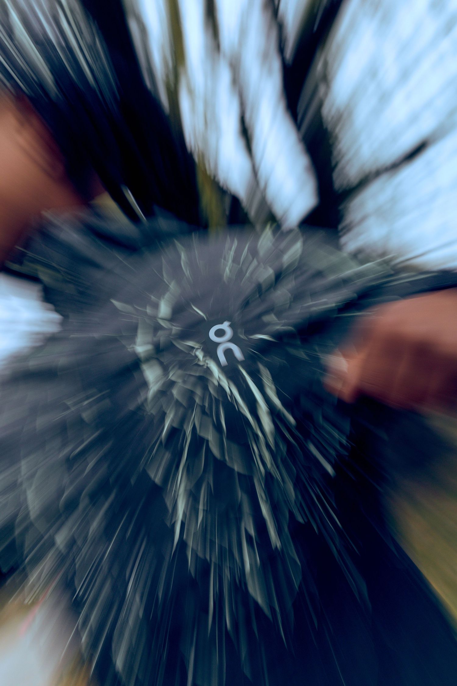Abstract black and white motion blur creating a dynamic radial pattern effect.