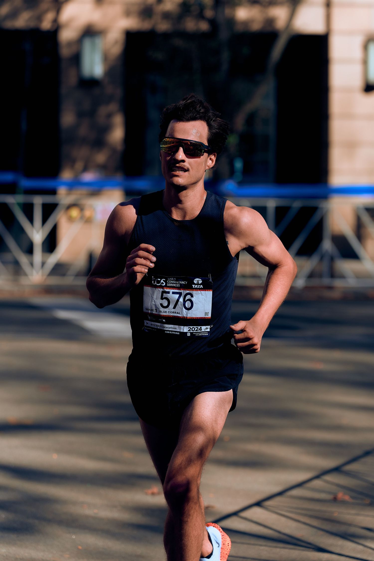 Runner with race number competing in an outdoor marathon event.