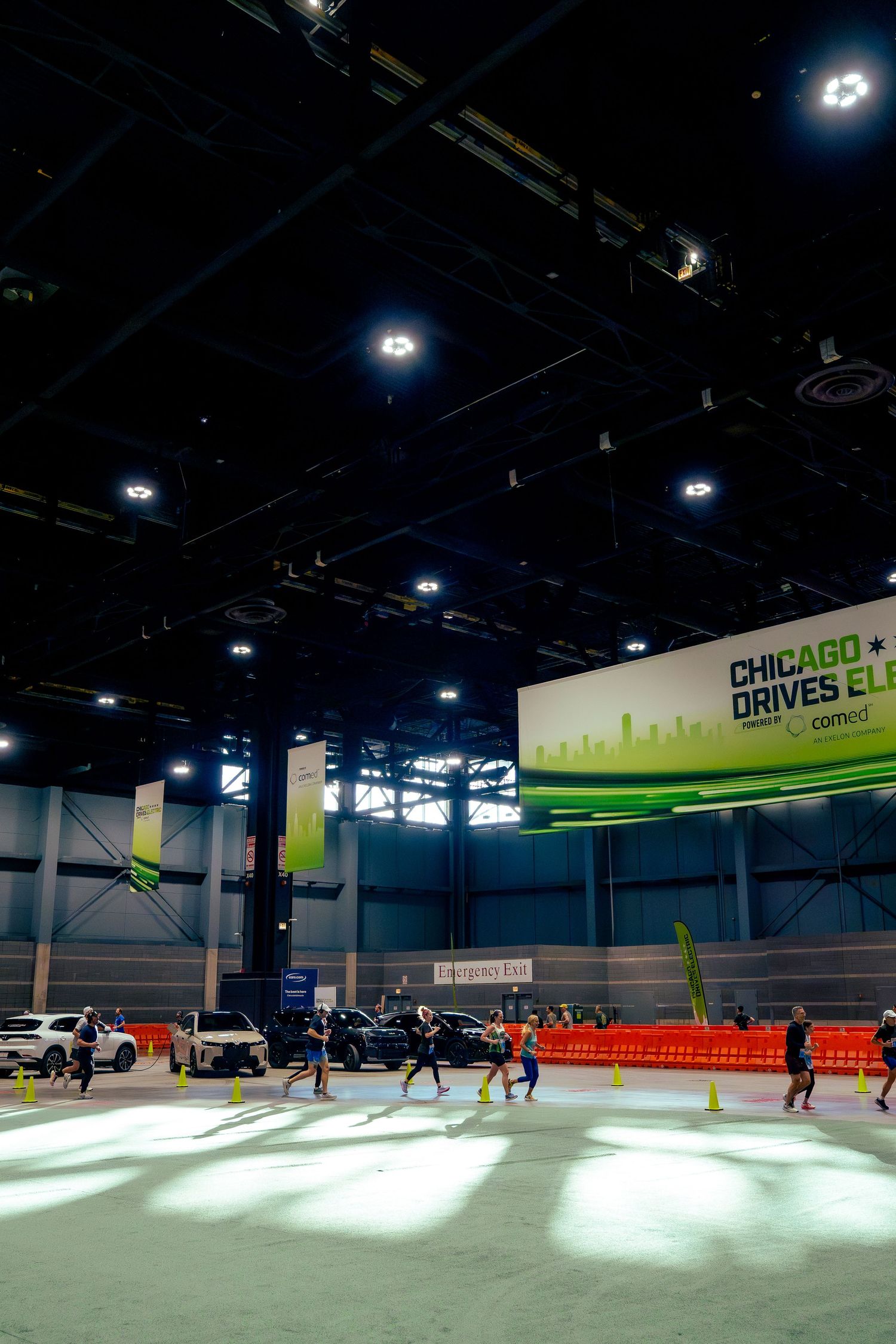 Large indoor event space with orange seating and Chicago signage visible.
