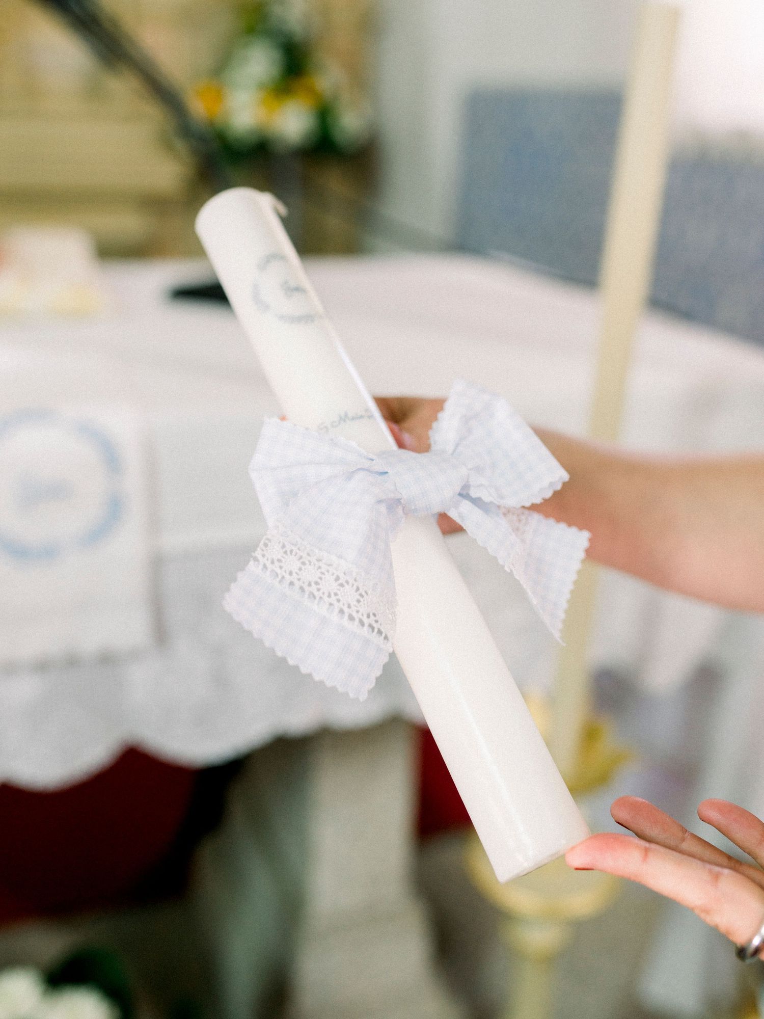 White paper diploma certificate with decorative lace border and ribbon shown in a blurred artistic style.