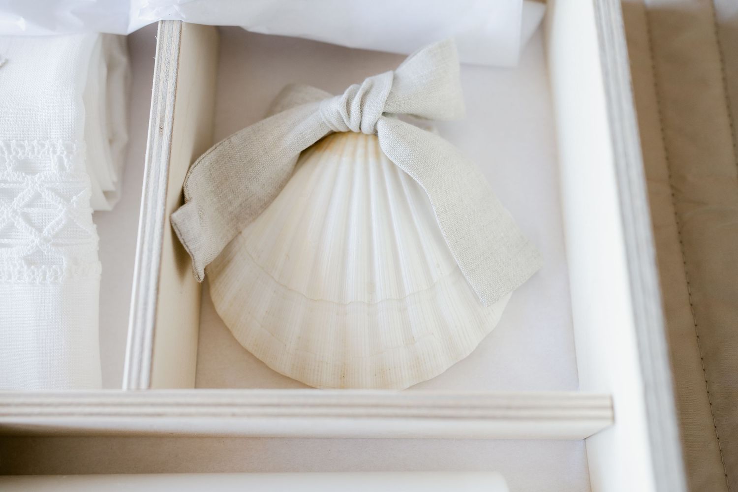 White ceramic pumpkin decorations displayed on elegant shelves create a minimalist fall decor arrangement.
