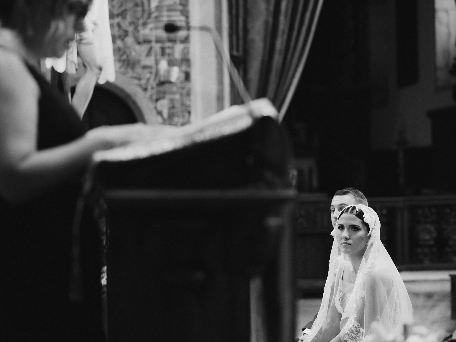 Black and white photo montage showing a bride in a flowing wedding dress and veil posing in different elegant positions.