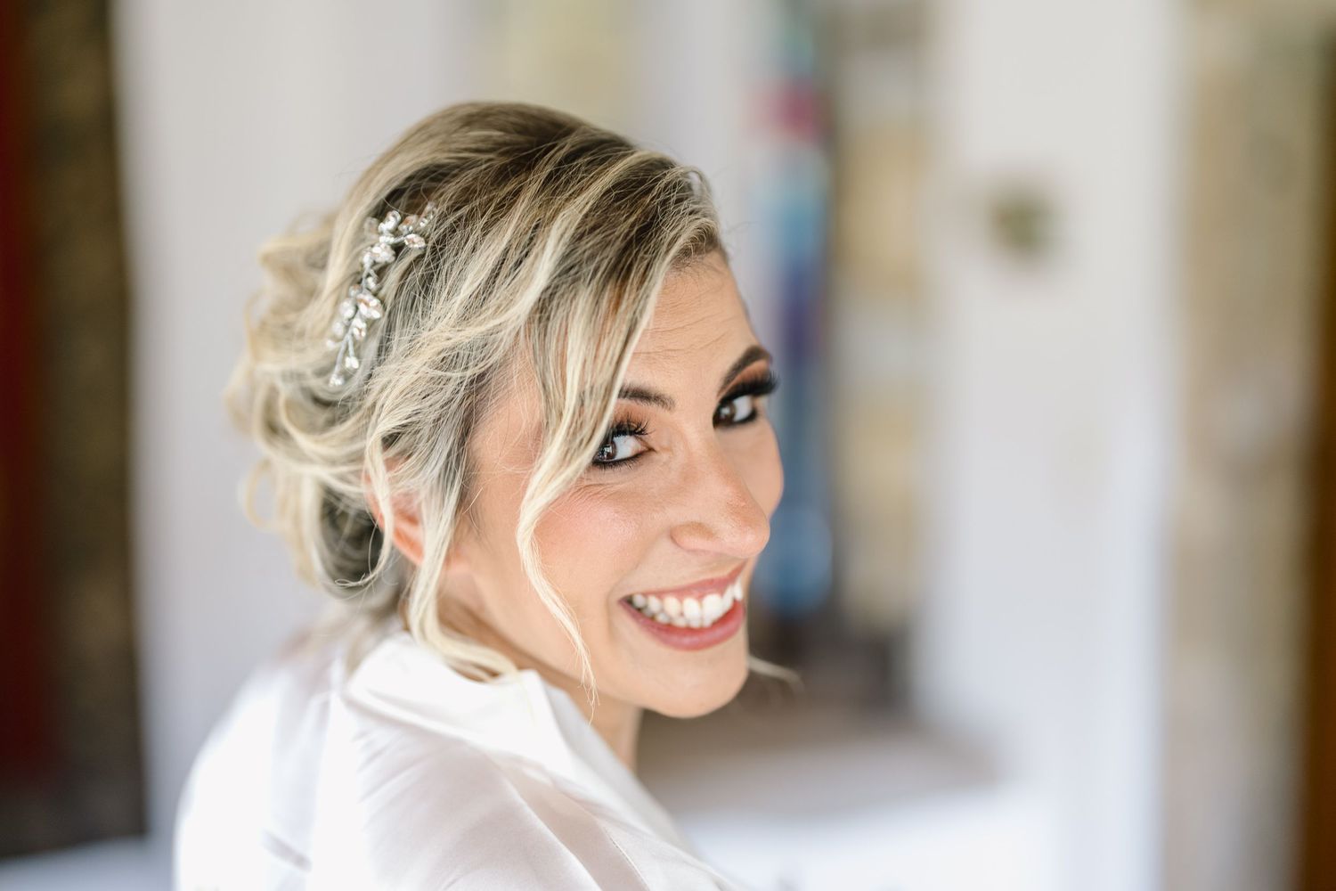 A collection of five headshots showing elegant bridal hairstyles with blonde updo styles and natural makeup.