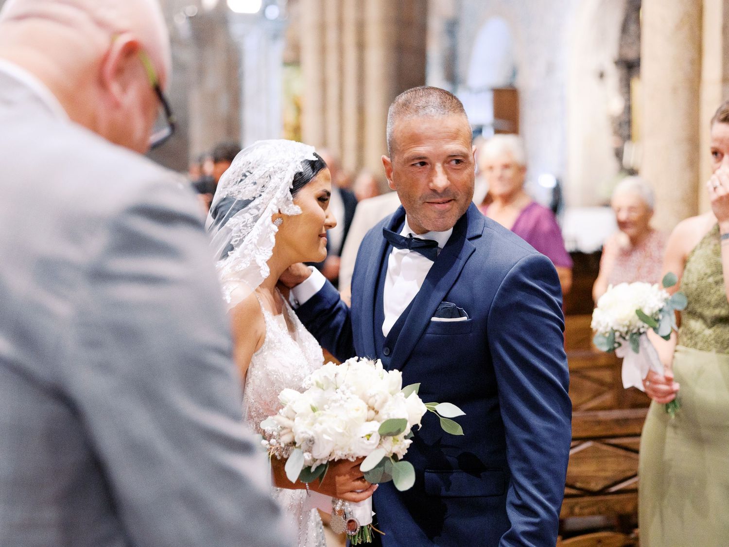 A series of wedding ceremony photos showing emotional moments between a couple in a traditional church setting.