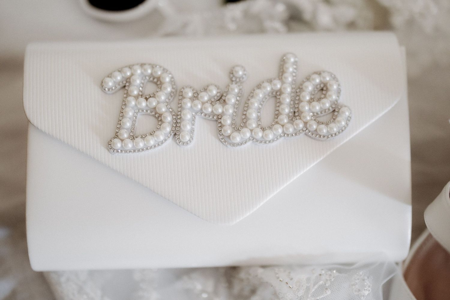 A collection of bridal hair accessories featuring pearl and crystal embellishments displayed on white surfaces.
