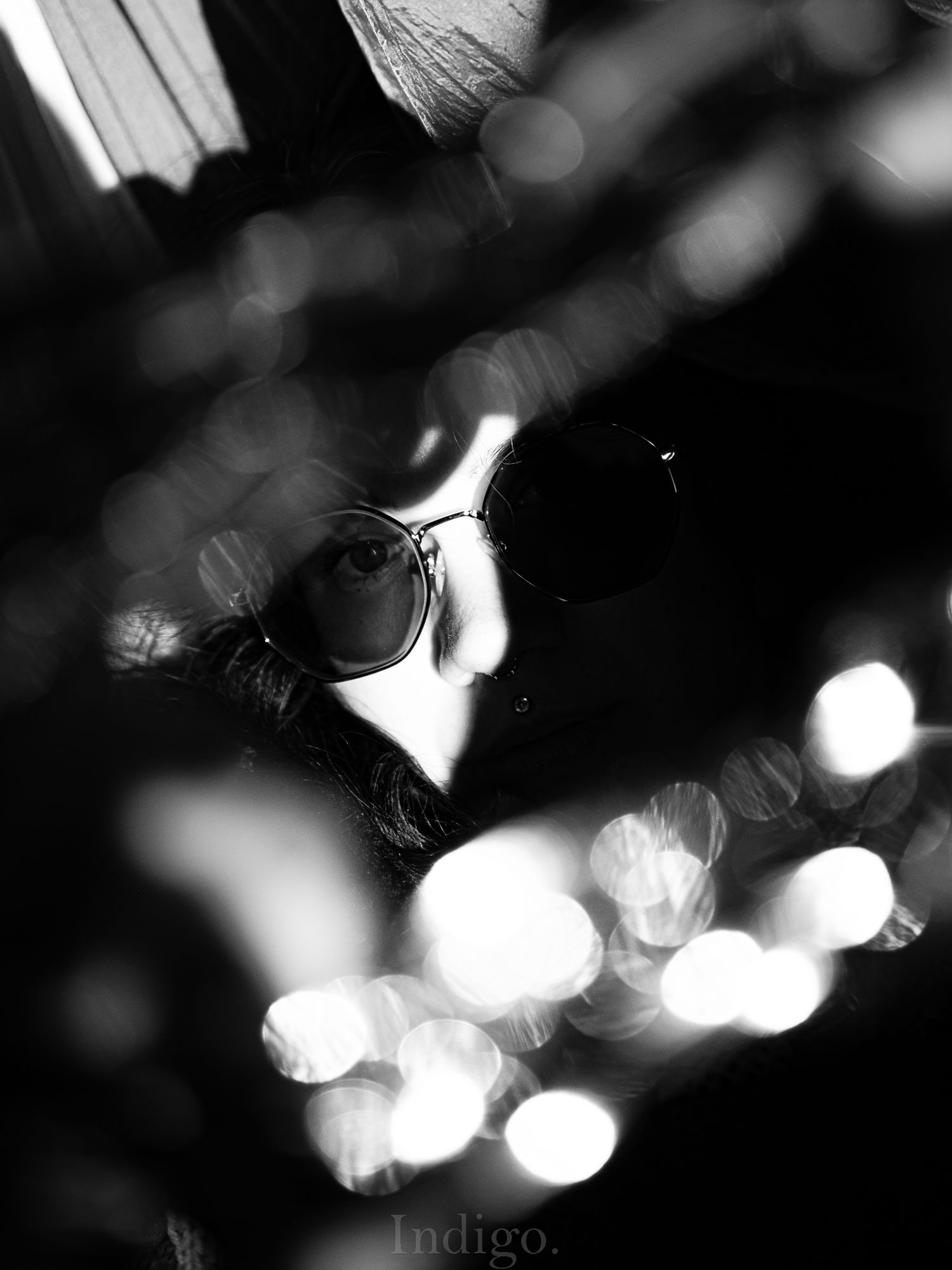 Abstract black and white bokeh lights creating a dreamy atmospheric effect.
