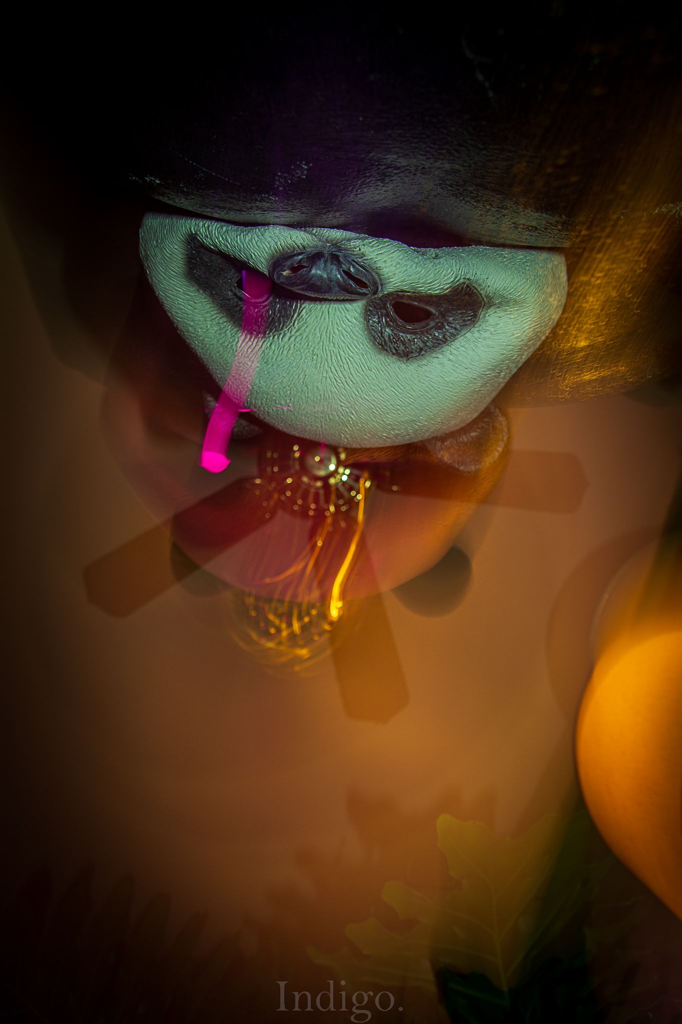 A series of abstract dark photos with glowing pink and orange lights creating an ethereal atmospheric effect.